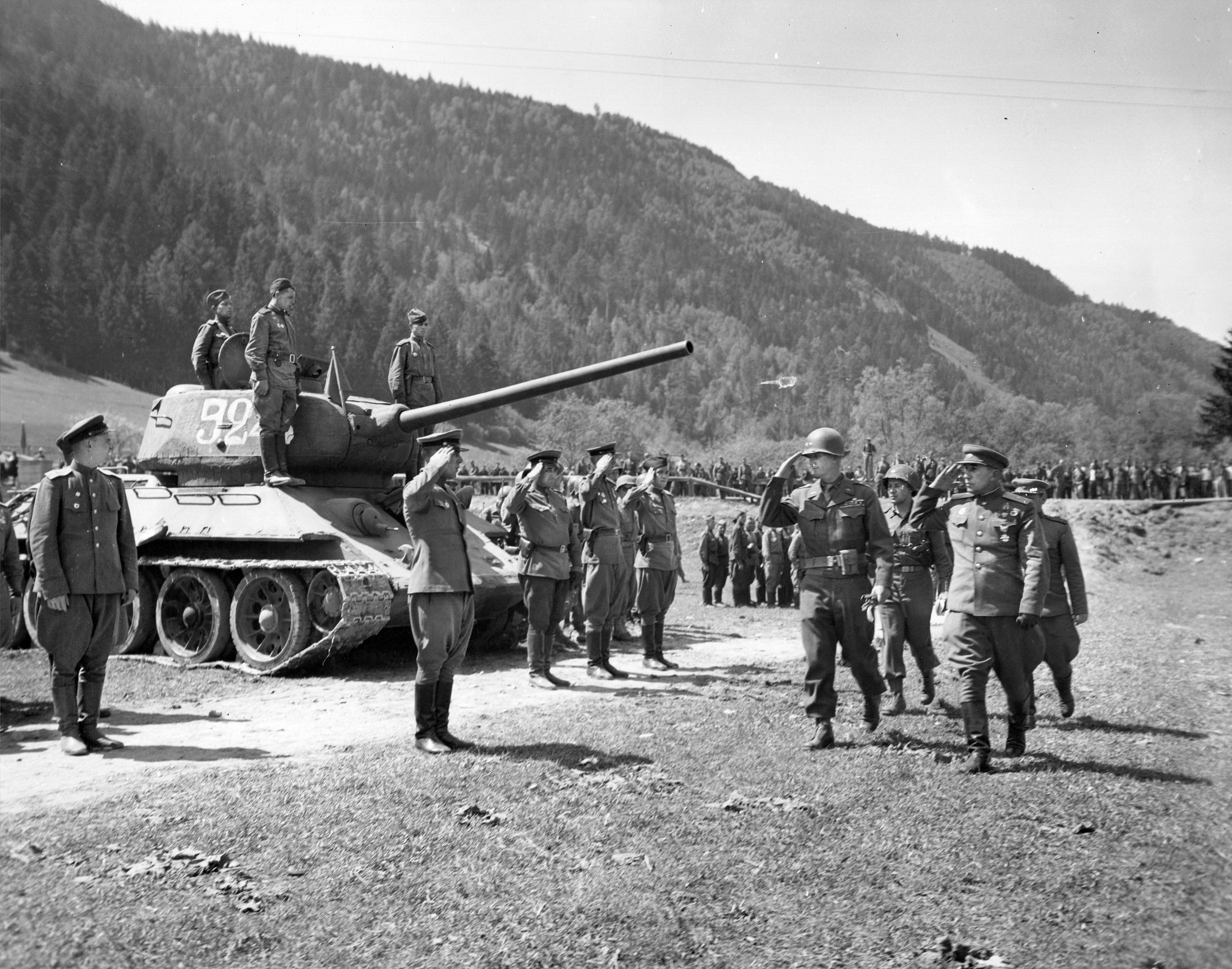 General Horace McBride, commander of the 80th Infantry Division, and Major General Pavel Voskresensky of the Red Army 21st Rifle Division inspect a Soviet unit near the town of Liezen, Austria, along the Enns River on May 11, 1945. This photo was taken just three days after the end of World War II in Europe.