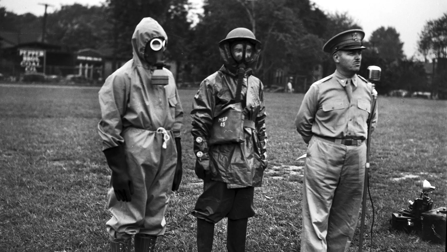 American soldiers model gas masks and protective gear during a press conference in Detroit in 1942.