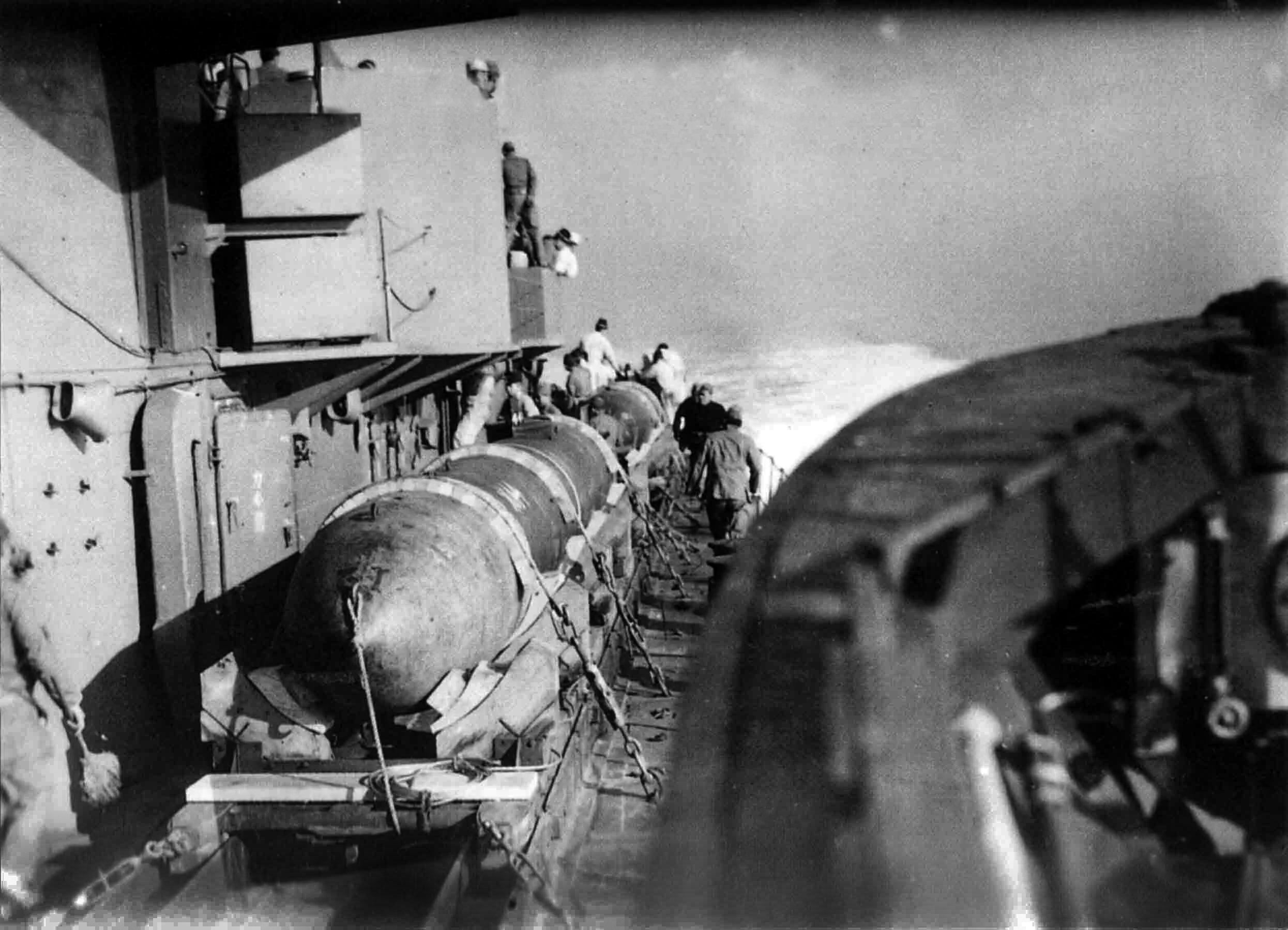 Sailors prepare the Kaiten—modified torpedoes—for an attack. Imperial Japanese Navy submarines equiped with Kaiten typically carried four of the piloted mini-subs.