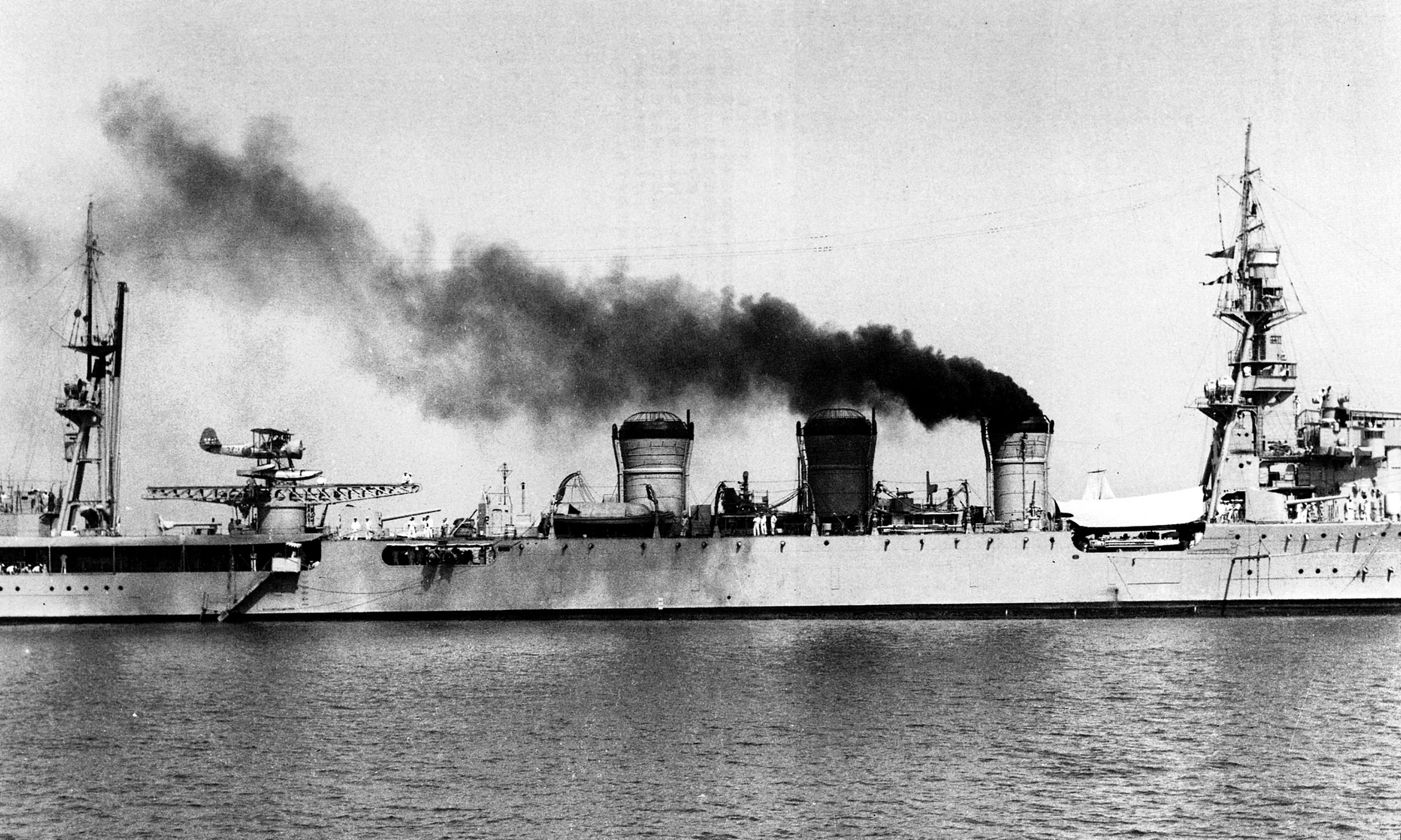 The Japanese cruiser Kuma, shown here off the coast of Tsingtao, China, in 1935. On April 9, 1942, PT-34 and PT-41 ambushed the Kuma in the Tañon Strait between the islands of Negros and Cebu, hitting it with a torpedo that caused significant damage. Note the Mitsubishi F1M2 Pete floatplane on the Kuma’s catapult.