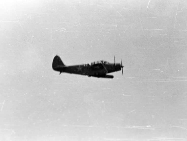 An Mk 13 torpedo slung below its fuselage, this TBD-1 Devastator, most likely from Torpedo Squadron 3 off the USS Yorktown, searches for Japanese ships on June 4, 1942.