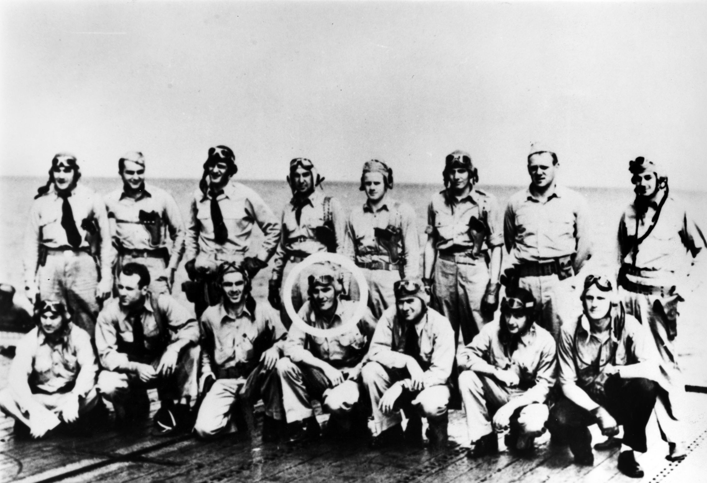 Members of the aircrew of Torpedo Squadron 8 photographed on the flight deck of the USS Hornet in May 1942. The squadron was decimated at the Battle of Midway the following month, with Ensign George Gay (circled) the only survivor from Torpedo 8 that flew from the USS Hornet. Squadron commander, Lieutenant Commander John C. Waldron, is shown standing third from left. 