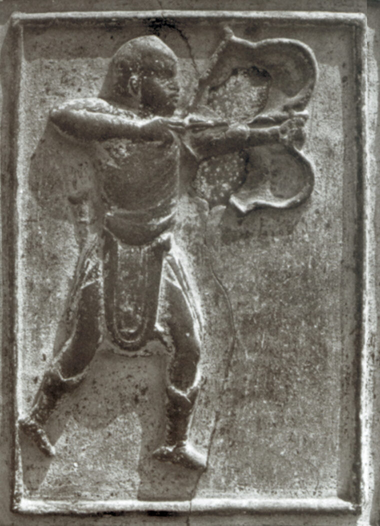 A Norman warrior in Italy as shown on an Italian cathedral door. He is using a recurved bow.