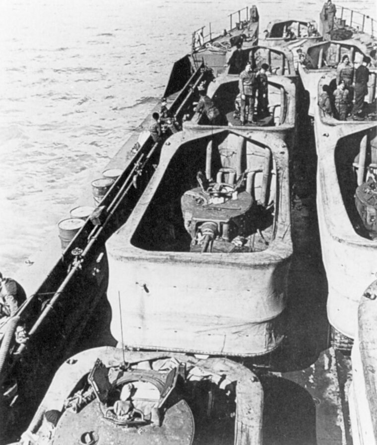 Used only for training, British Valentine DD tanks are loaded on an LCT with their shrouds up. The Valentines were substitutes for the 33-ton Shermans that would be used for the D-day landings. Most did not make it to the beach on their own due to heavy seas.