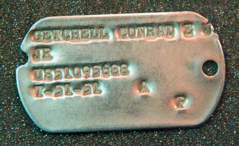 An M1941 tag style worn in 1951; the “US” indicates the soldier was a draftee.