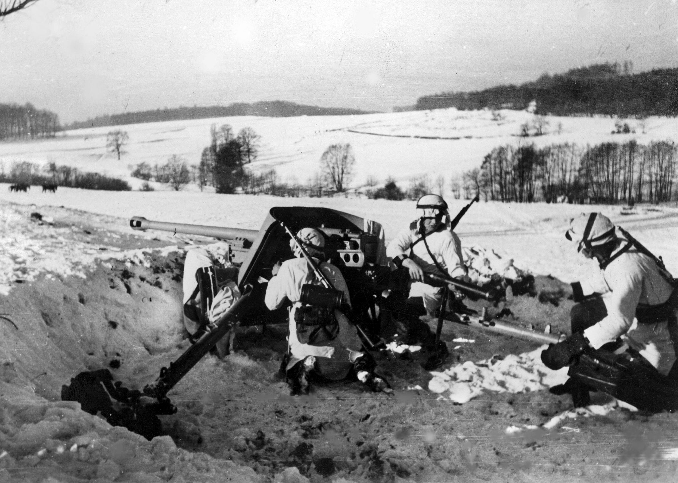 Ethnic Ukrainian troops of the German 14th Waffen Grenadier Division in winter gear with 5cm PaK 38 gun, March 1944.