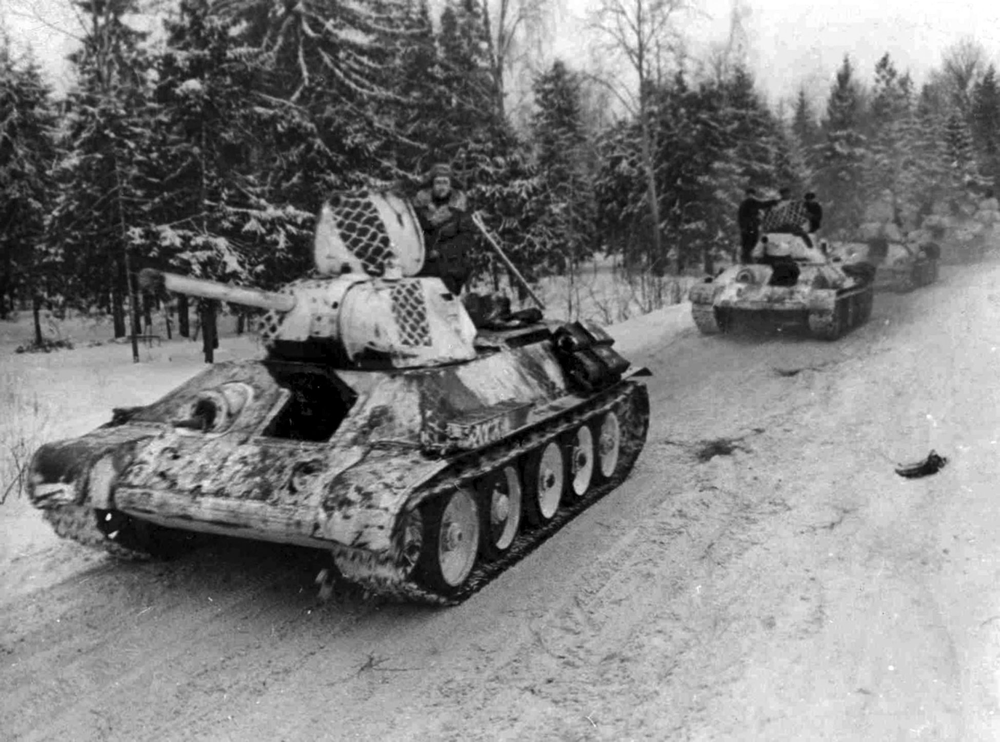 A column of Soviet T-34 tanks with winter “tire track” camouflage. The Russian forces held a numerical advantage of nearly five tanks to one over the Germans at the Battle of the Korsun-Cherkassy Pocket. In artillery, the ratio was estimated to be about 10-1 in favor of the Soviets. 