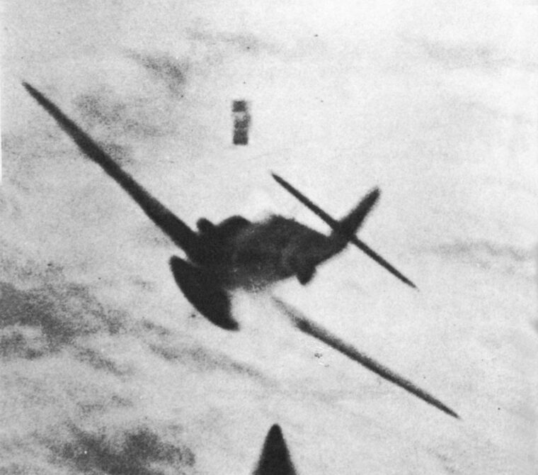 Caught by the gun camera of an attacking Allied fighter, the pilot of a stricken German plane tumbles from his cockpit before the machine goes into a death spiral.