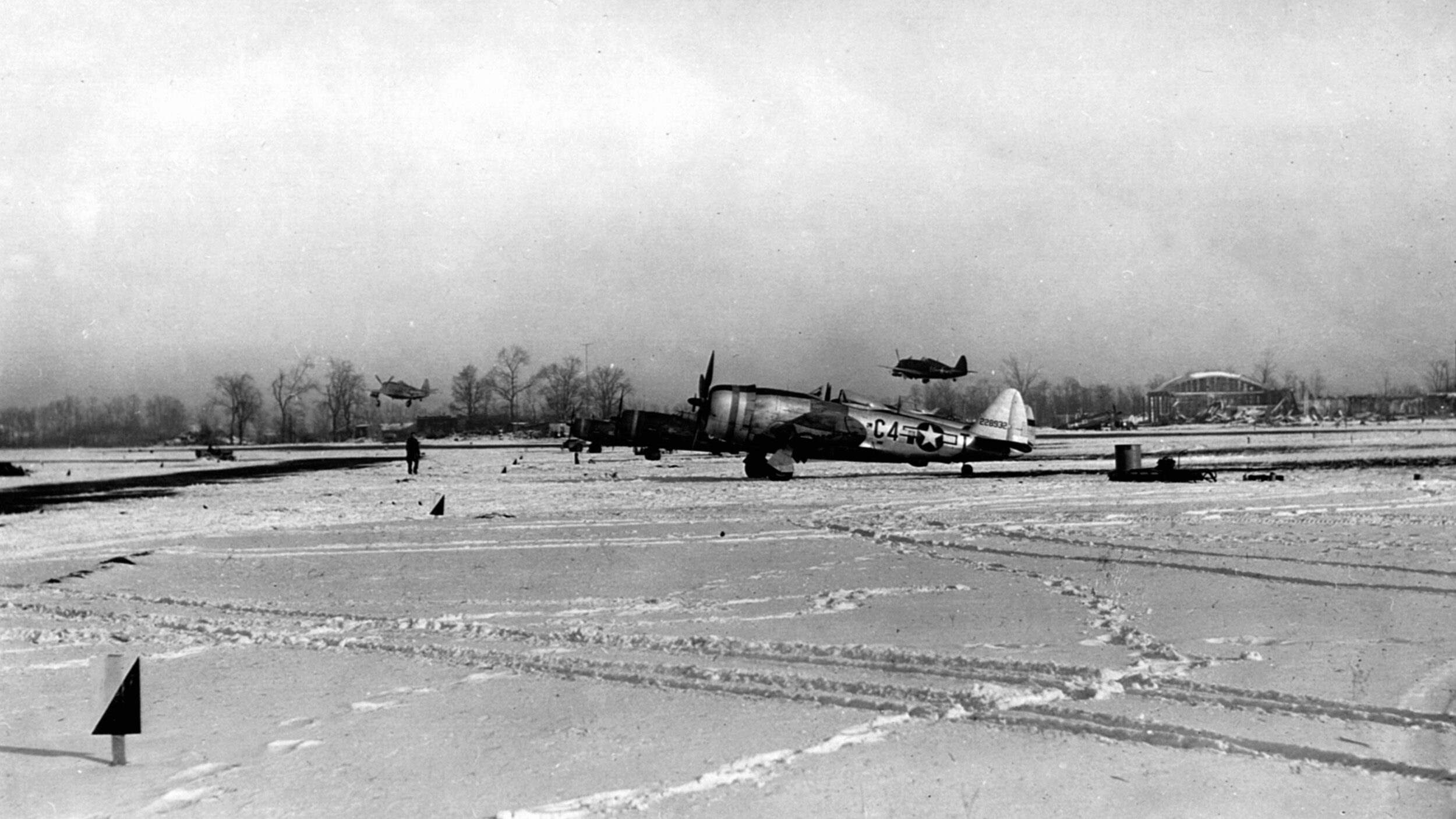P-47 Thunderbolts of the 365th Fighter Bomber Group take off from a forward airbase on a mission to strafe German motorized transports. Tactical air support provided by the Ninth Air Force proved invaluable during the offensive in Western Europe.