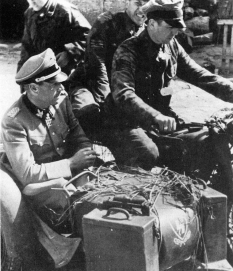 Kurt Meyer sets off on a reconnaissance mission in Normandy with his commander Fritz Witt.