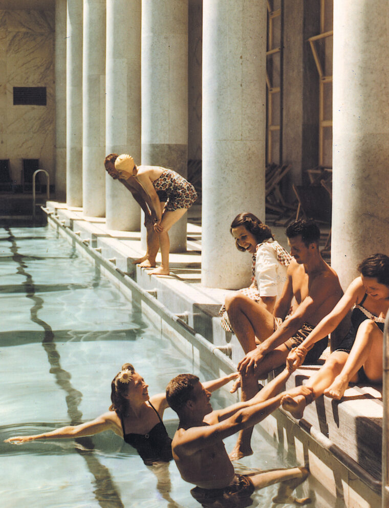 Everybody into the pool! American Red Cross girls and soldiers of the 34th Infantry Division “caper” in the palatial swimming pool at a U.S. Fifth Army rest center on the outskirts of Rome. The rest center had formerly been the Mussolini Youth Center.