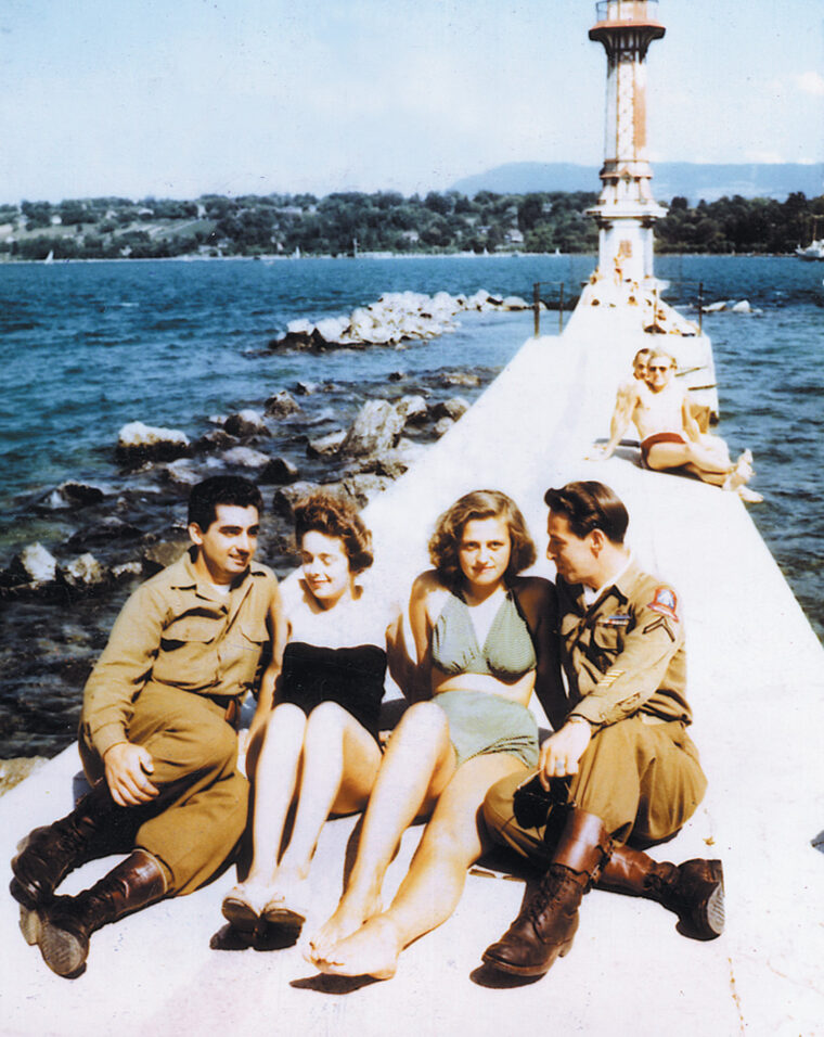 In Switzerland, two Fifth Army soldiers enjoy the sites along a pier with two women from Geneva.