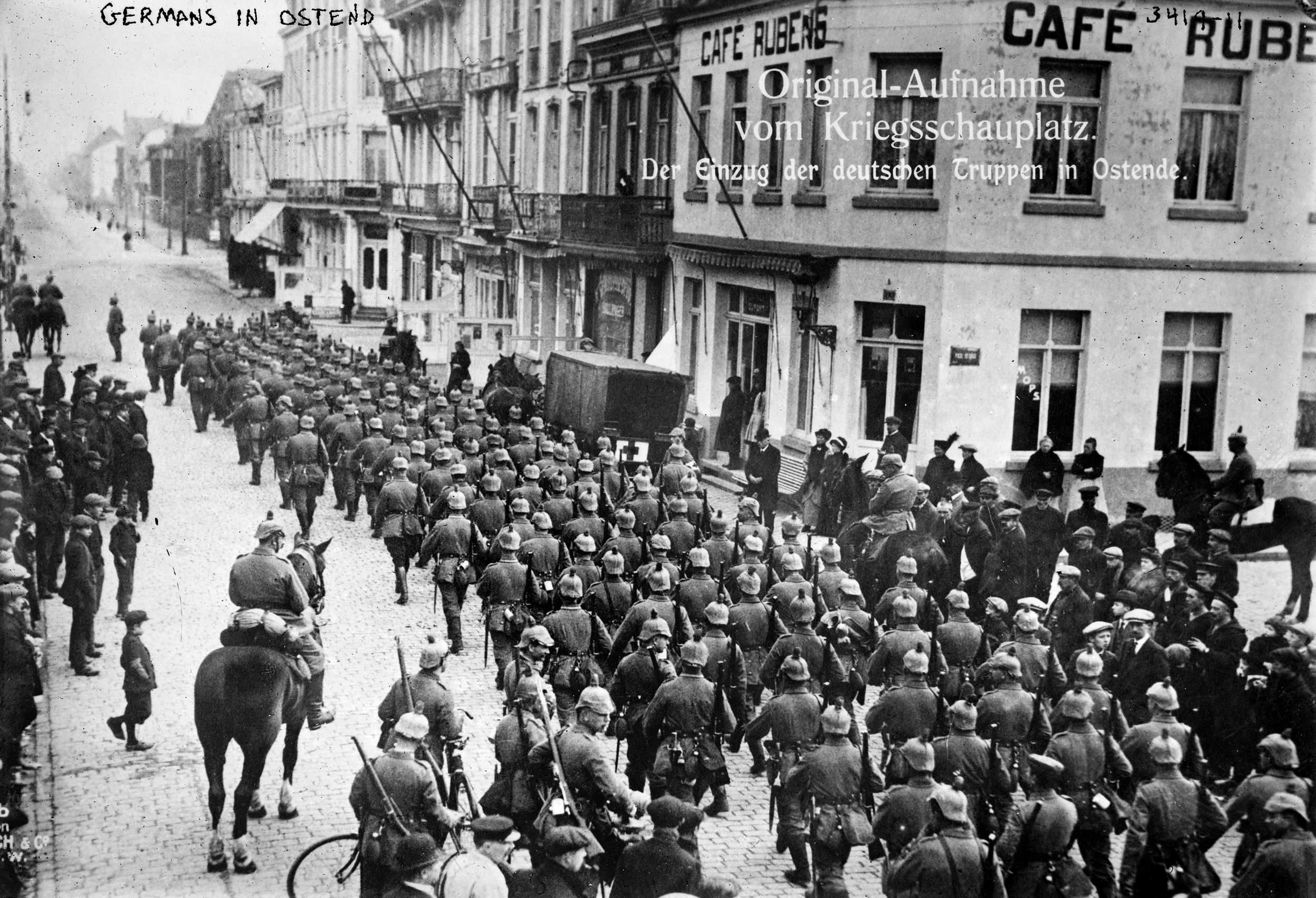 German soldiers passing the Cafe Rubens as they march in the streets of Ostend, Belgium, on their way to France. Despite the overwhelming odds, the Belgians put up unexpectedly stiff resistance—German troops had seized the city of Liege by August 6, but did not take  the fortifications ringing the city until August 16. The Germans marched into Brussels on August 20 on their way to what they thought would be a quick invasion of France. 