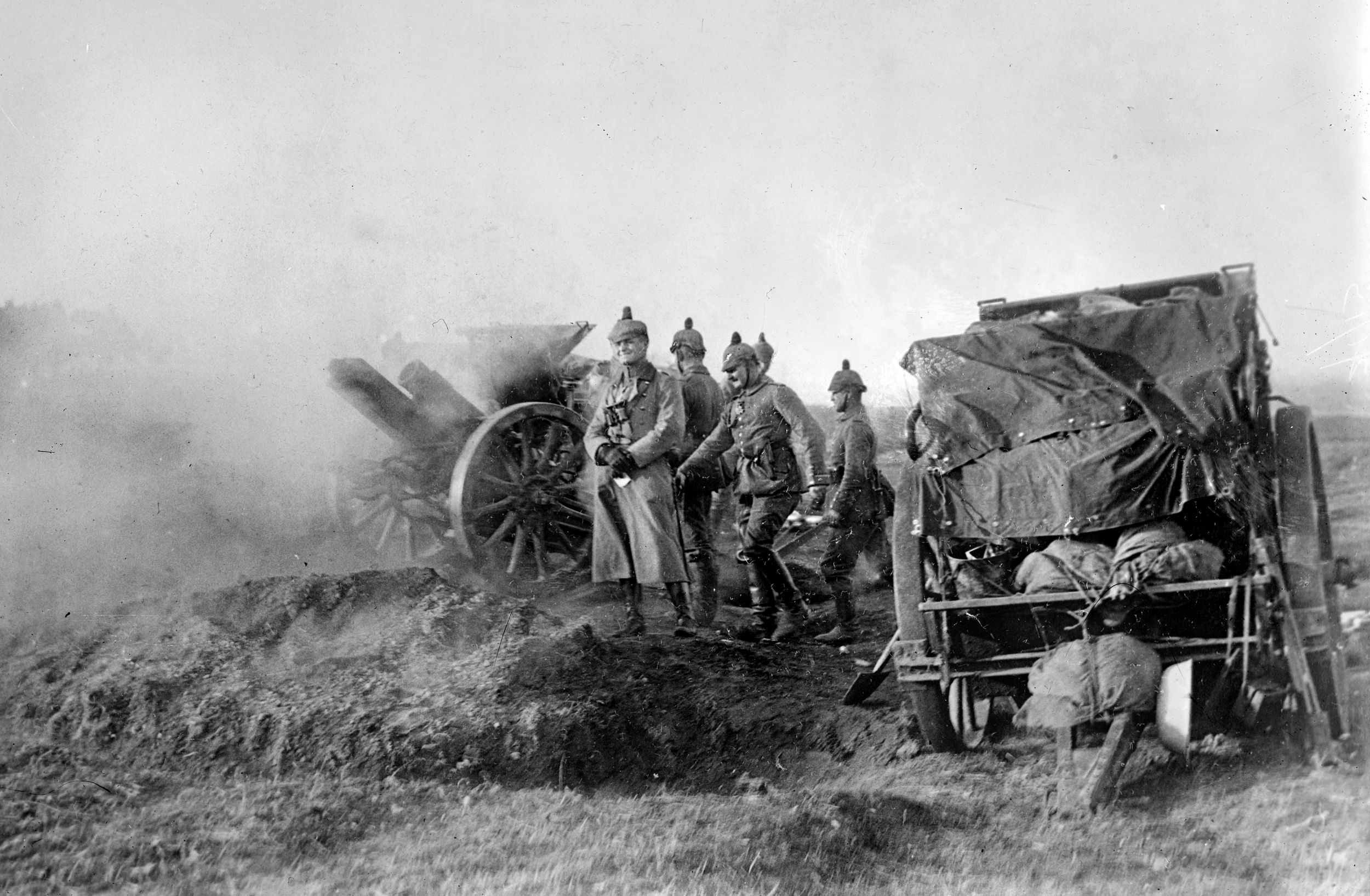 German artillery crew with a 10.5cm Feldhaubitze 98/09 howitzer fires on French positions in 1914.  The British referred to these guns and their shells as "five point nines" or "five-nines" as the internal diameter of the barrel was 5.9 inches (150 mm).