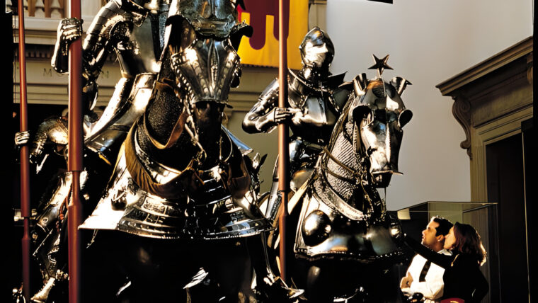 Knights and their armor-clad chargers pose in all their shining glory among the banners and high win- dows of the Equestrian Court at the Metropolitan Museum in New York City. The museum holds an exquisite collection of arms and armor.