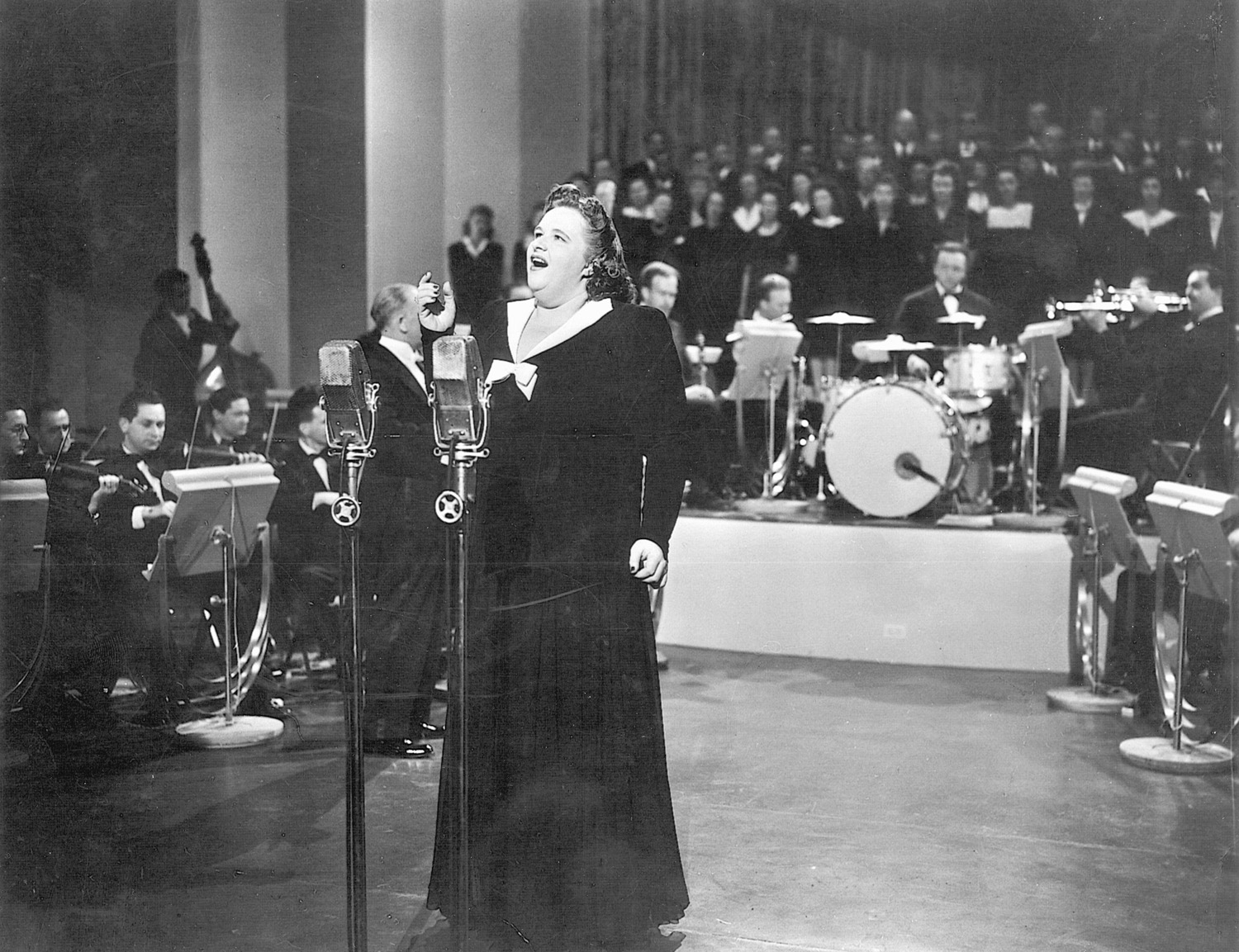 Famed singer Kate Smith sings “God Bless America. The unforgettable music of WWII stirred feelings of patriotism, the sorrow of separation, and romance.
