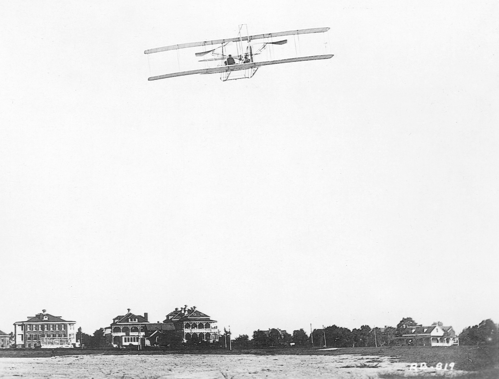 A Wright brothers airplane flying over Fort Myer, Virginia. Foulois was the first military man to fly with the Wright brothers. He saw the potential of air power immediately and dedicated his life and career to the air military arm. 