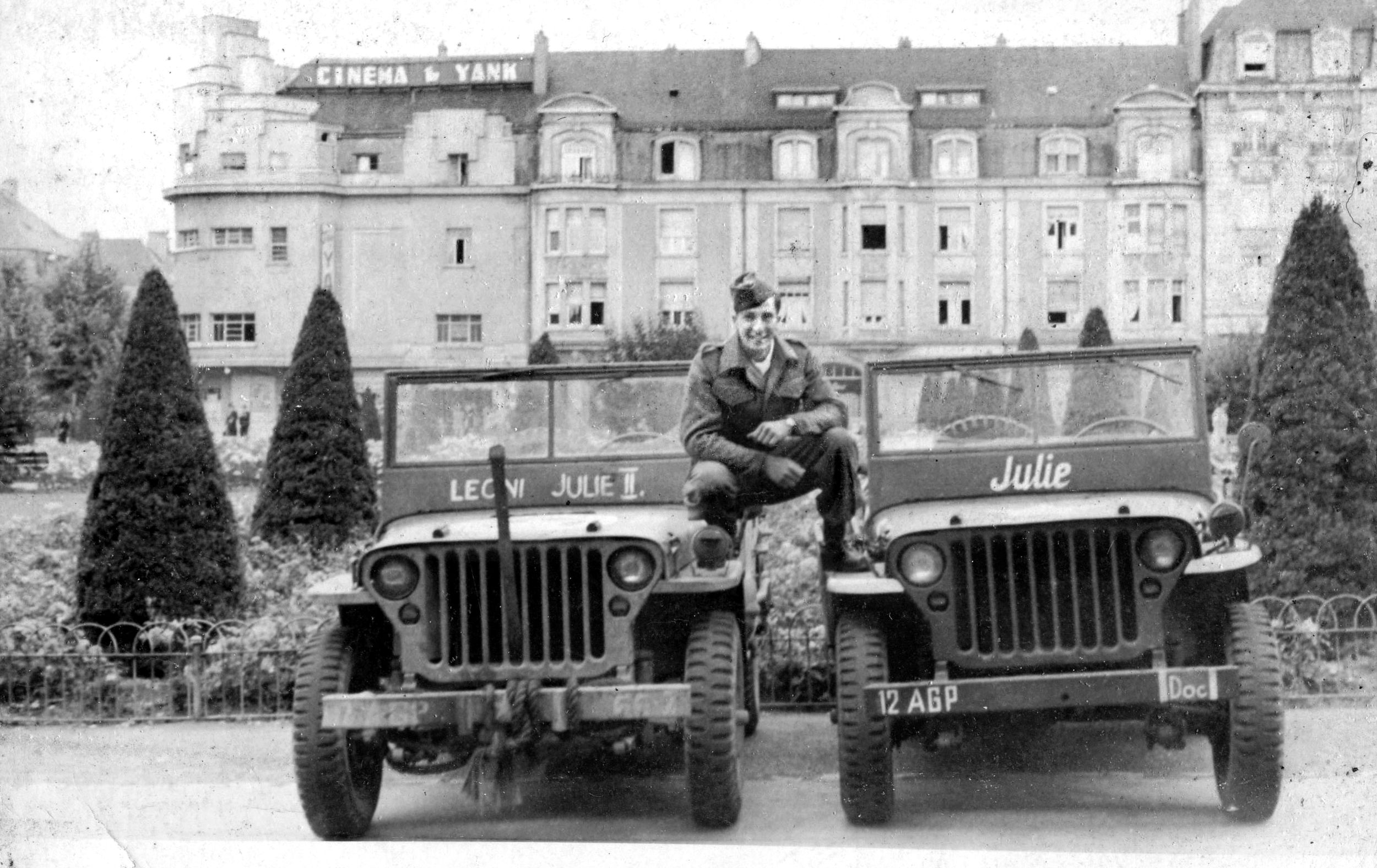 PFC Cohn straddles two jeeps used by Prisoner of War Team 66. He served under General Omar Bradley’s 12th Army Group, which can be identified on the right jeep’s front bumper.