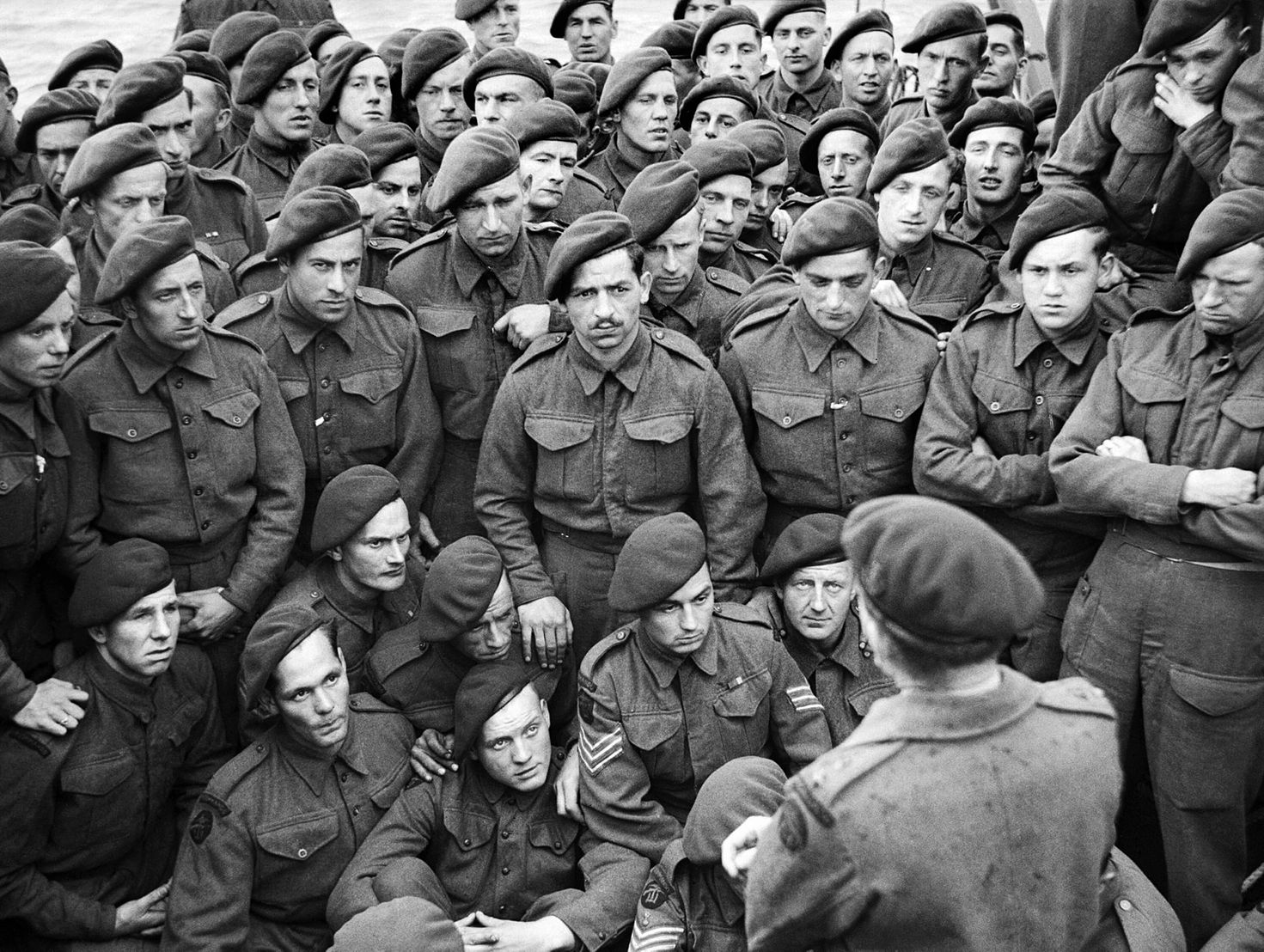 Lieutenant Colonel Robert W.P. Dawson briefs his men of No. 4 Commando, 1st Special Service Brigade, aboard the landing ship infantry (LCI) Maid of Orleans on June 5, 1944, the eve of D-Day.