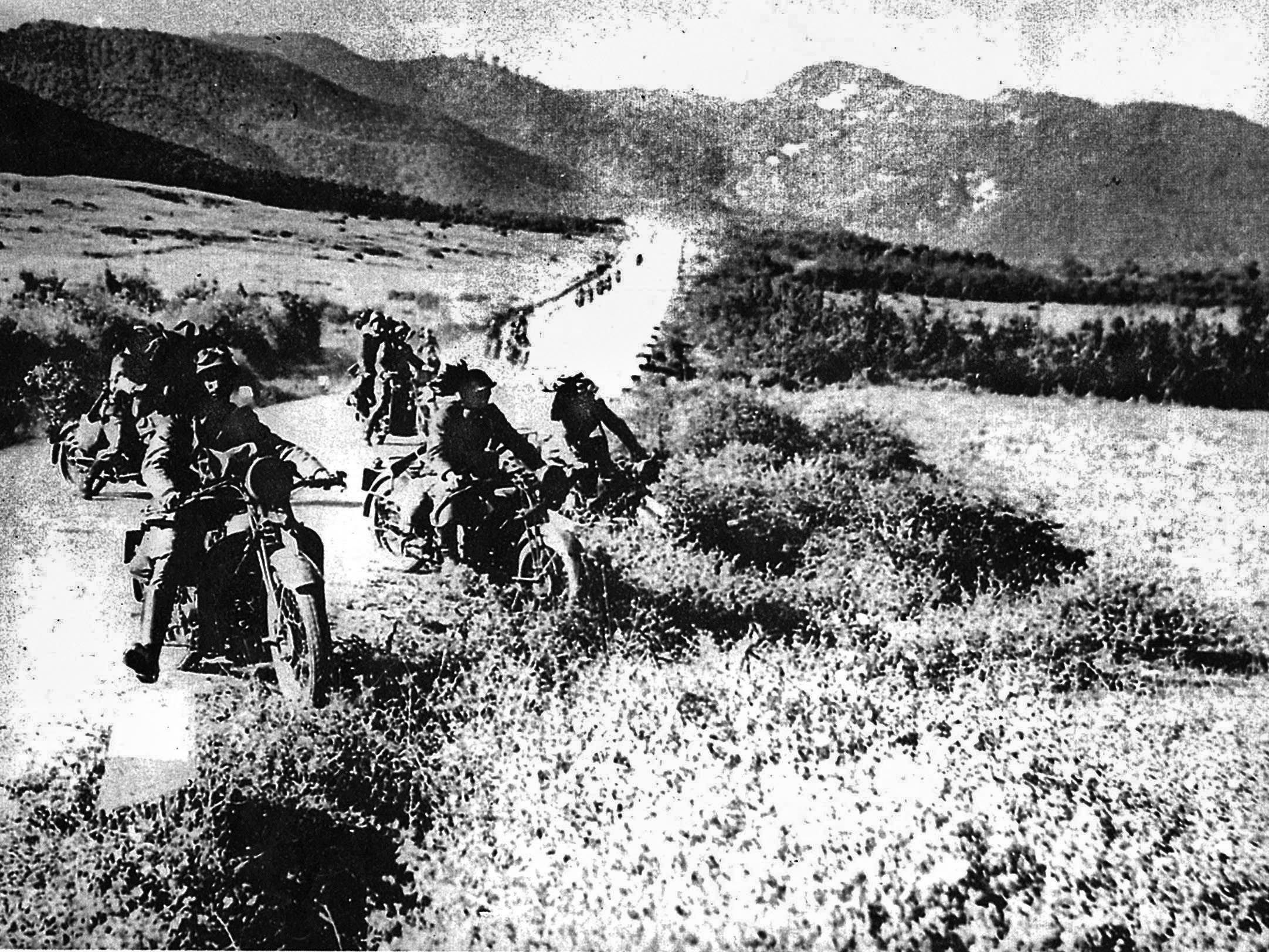 An elite force of motorcycle-mounted Italian Bersagliari troops, identifiable by the feathers from black capons on their sun helmets, roll into northern Greece. Poorly led, the Italians met stiff resistance just inside Greece’s border. 