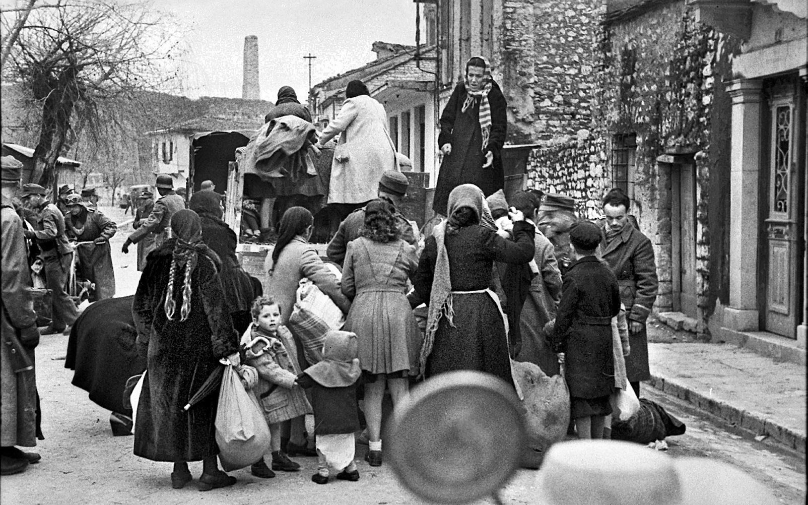 Greek Jews in the city of Ioannina, in northwest Greece, are rounded up to be transported to a concentration camp, March 25, 1944. 