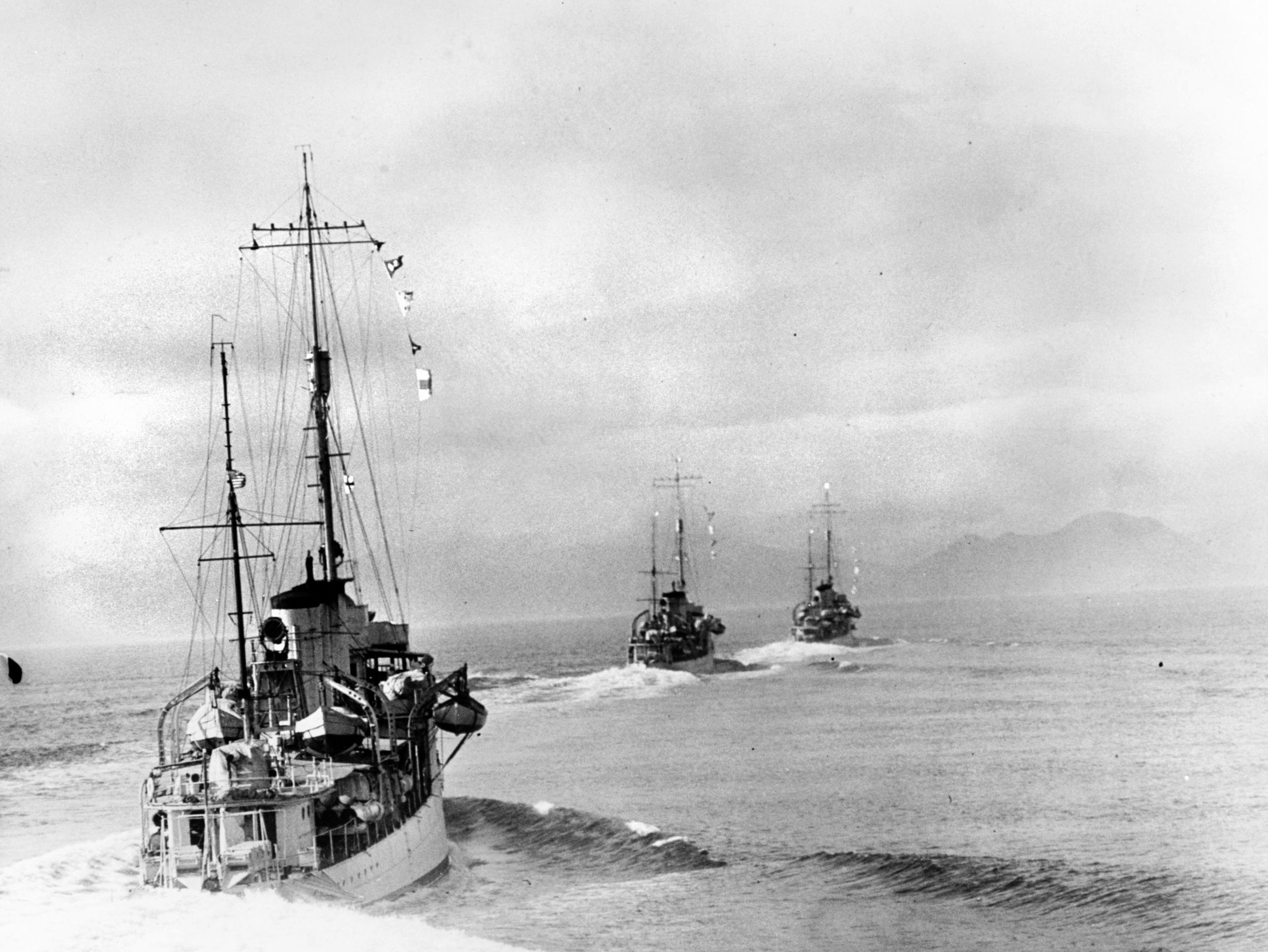 USS Trever (DD-339) (at left) follows USS Zane (DD-337), in the center, and USS Borie (DD-215) as they make a high speed turn at Kelp Point, off Hecate Island, during their 1937 Alaska cruise.
