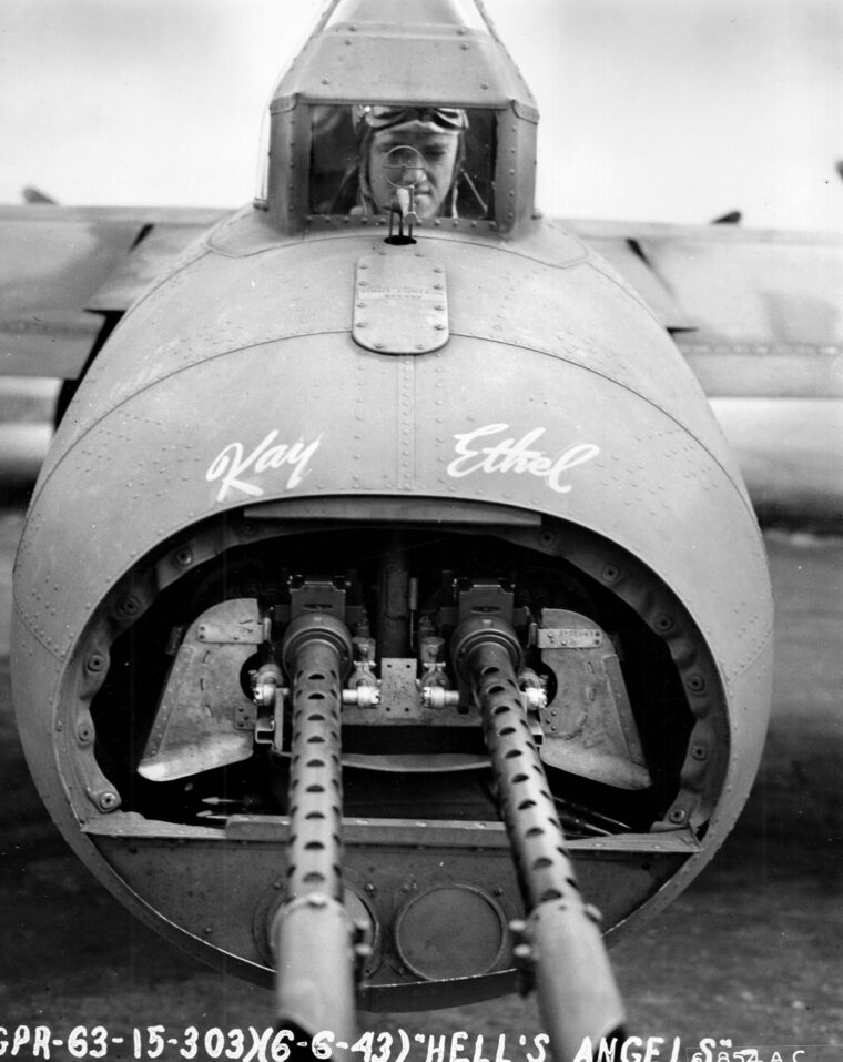 The tail gunner on the B-17 “Hell’s Angels” poses for a photo with his twin .50-caliber machine guns between missions. Tucker said that he once had to shake his guns at a USAAF rookie pilot who flew too close to his “office." 