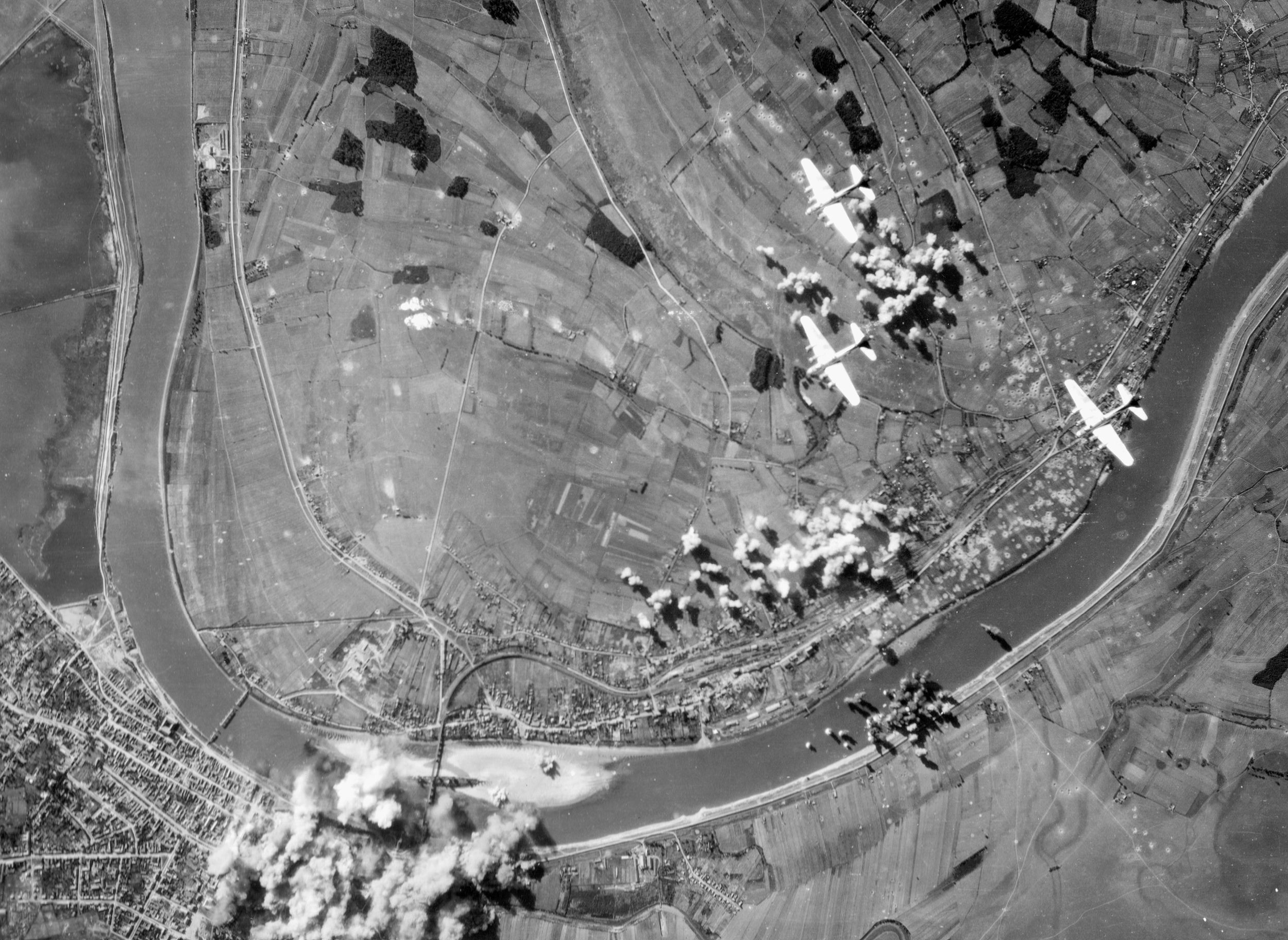 The marshalling yards at German-occupied Brod, Yugoslavia, feel the impact of bombs from the 414th Bomb Squadron, 97th Bomb Group, September 8, 1944.