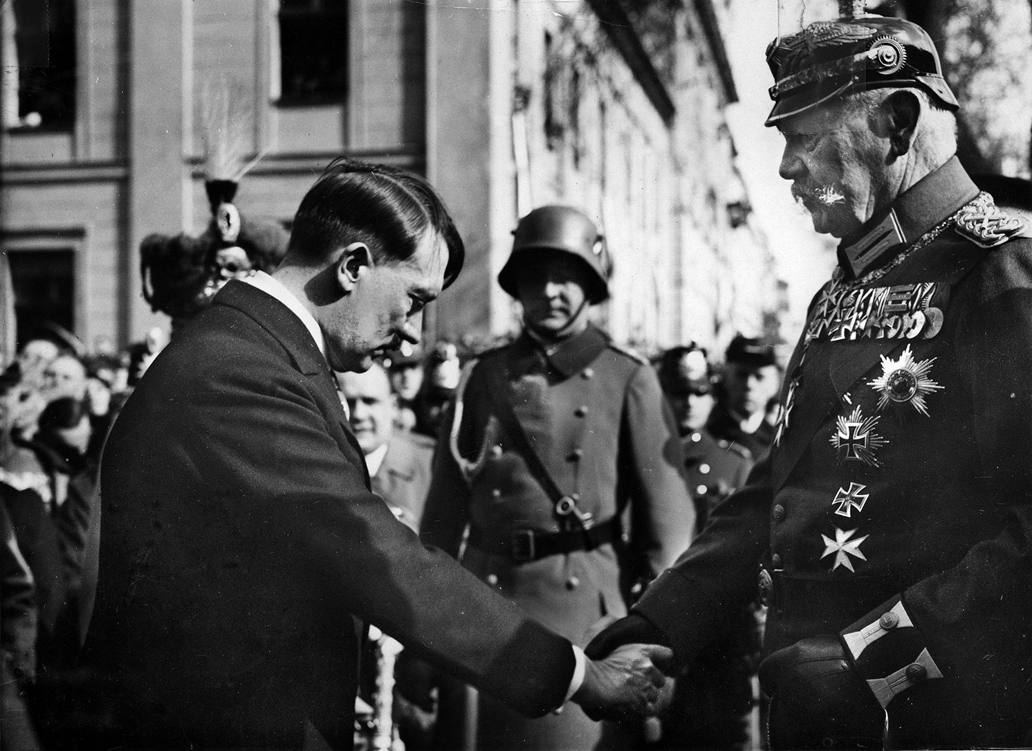 Adolf Hitler, the proverbial wolf in sheep’s clothing, bows subserviently before German President Paul von Hindenburg. Thinking that Hitler could be controlled, a group of German politicians persuaded Hindenburg to appoint the Nazi leader Chancellor of Germany in 1933. Albert Einstein soon fled the country.