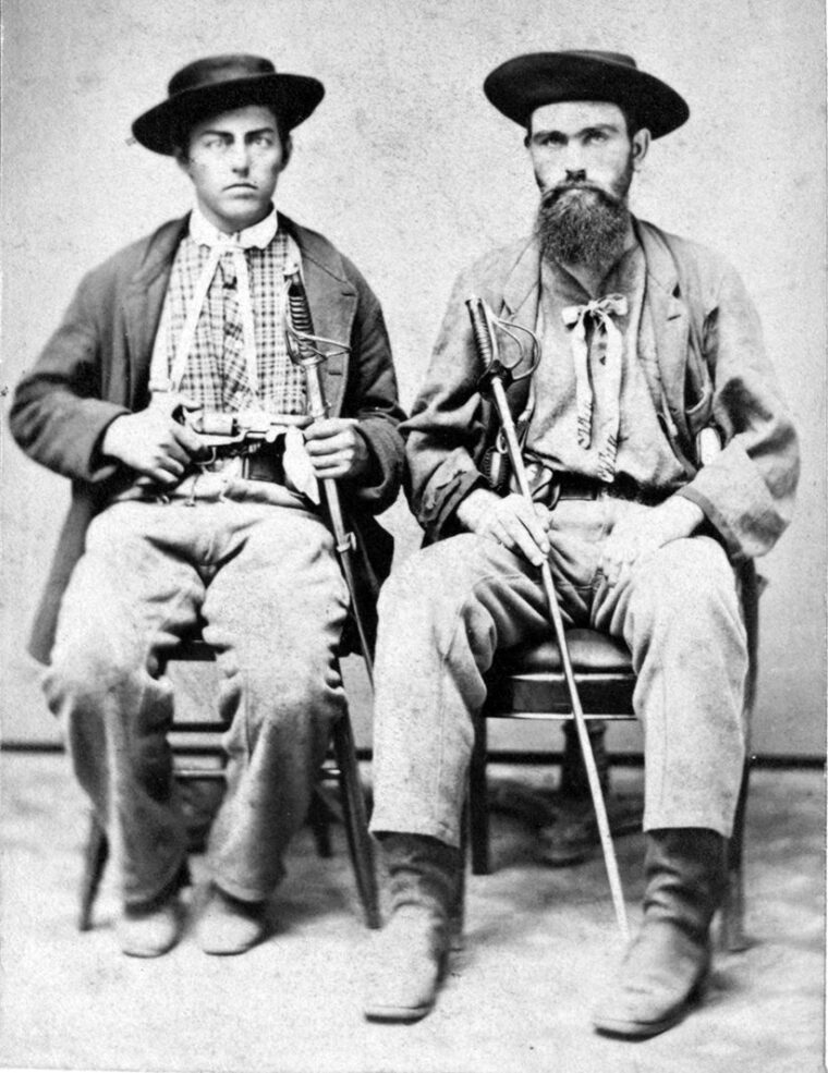 A photograph of two unidentified Border Ruffians with swords. When Kansas held its first elections for territorial legislature on March 30, 1855,  pro-slavery Missouri men like these came over to cast ballots and suppress anti-slavery voters.