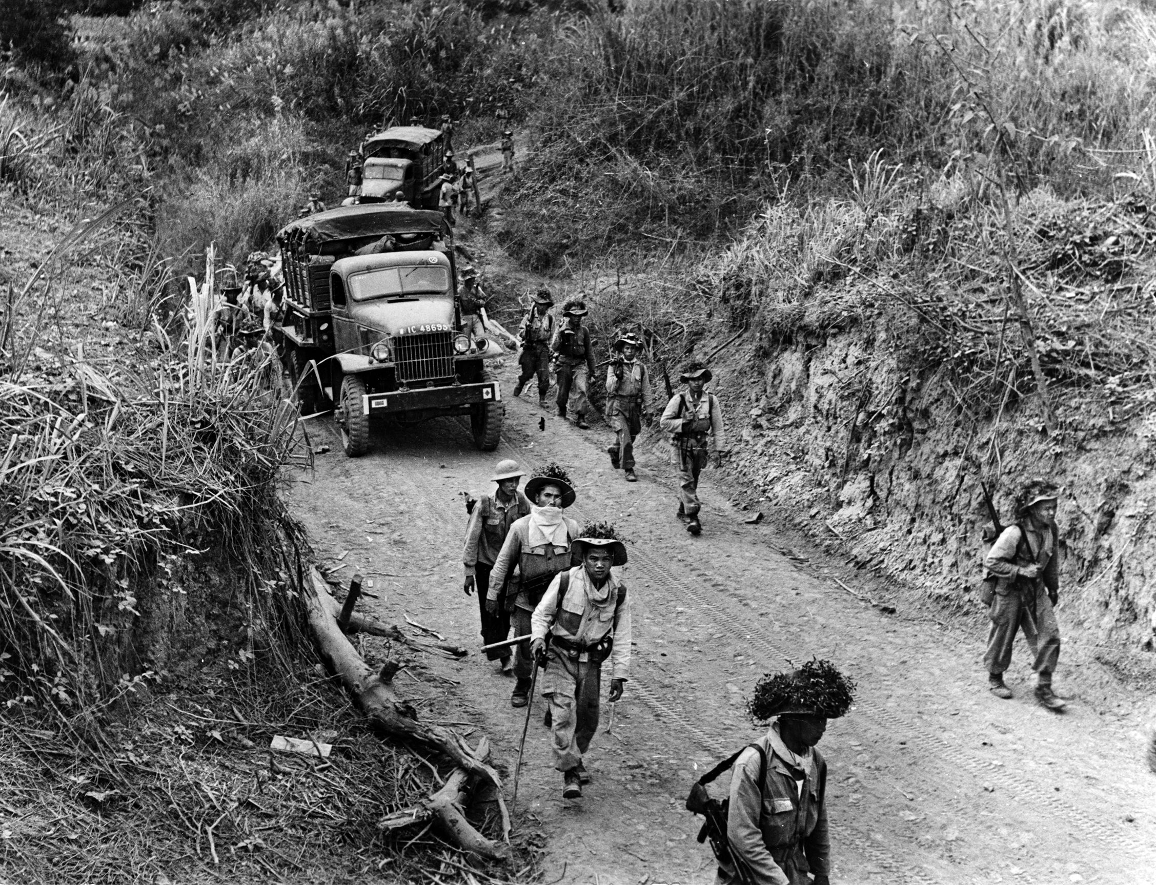 Troops and equipment make their way across the delta near Phu Doan at the intersection of the Chay and Clear rivers in January 1953.