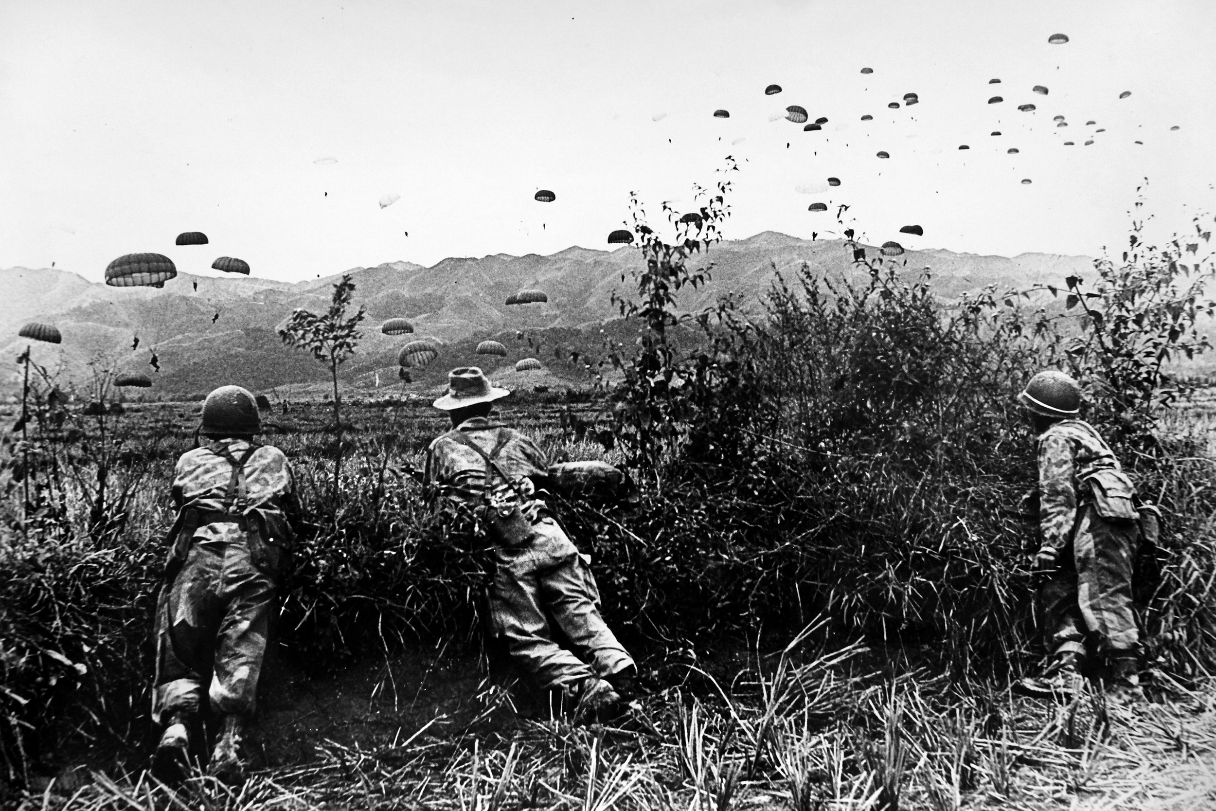 French paratroopers landing to participate in the Battle of Dien Bien Phu, (March 13 to May 7, 1954). In mid-October 1953, Col. Marcel Bigeard and the 6th Colonial Parachute Battalion dropped into the village of Tu Le to help the garrison at Gia Hoi evacuate back to the De Lattre Line. Fighting a rearguard action all the way, the battalion had a 60-percent casualty rate. 
