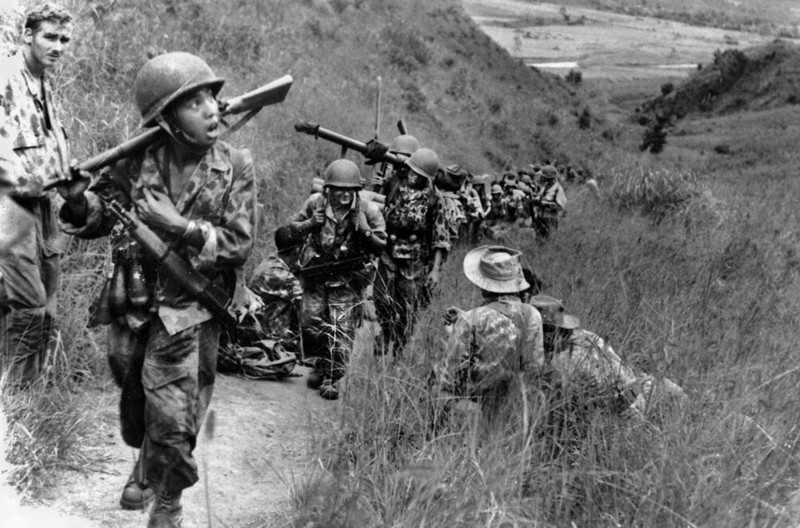 French paratroopers climb a mountain pass to get into position ahead of advancing Viet Minh forces on November 1, 1952. 