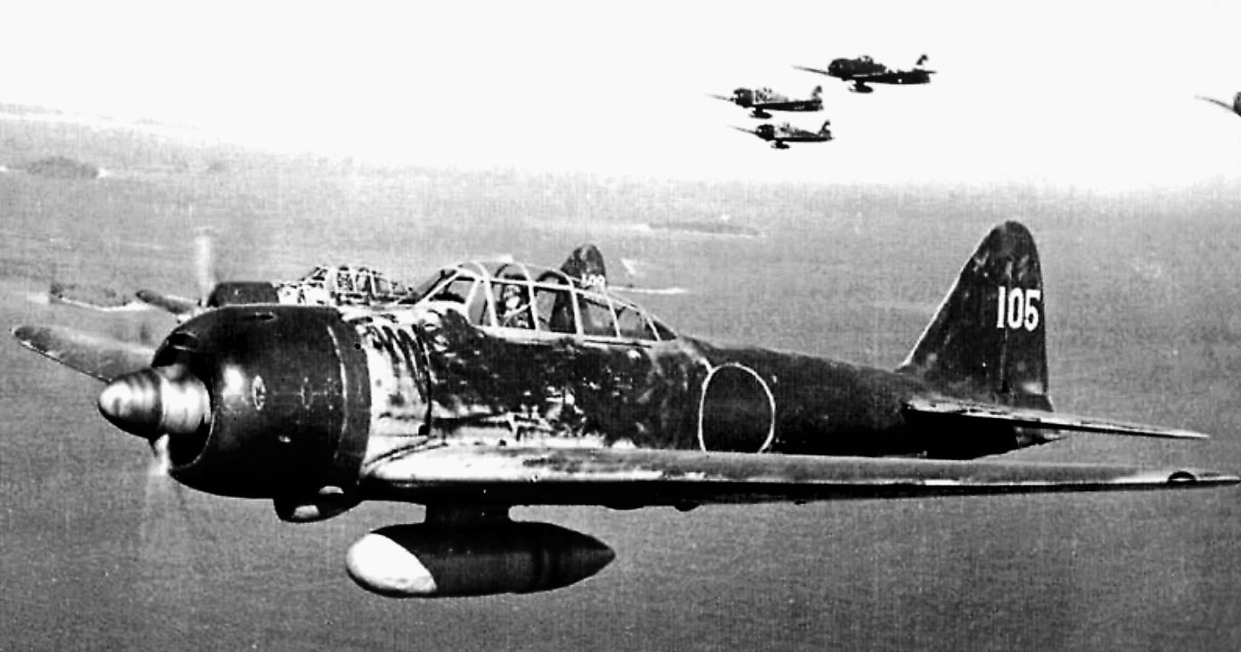 Japanese ace Hiroyoshi Nishizawa flies a Mitsubishi A6M3 Model 22 over the Solomon Islands in 1943. The Zero was typically armed with two 20mm cannons, two 7.7mm (.303-inch) machine guns and two 60-kg (130-lbs.) bombs.