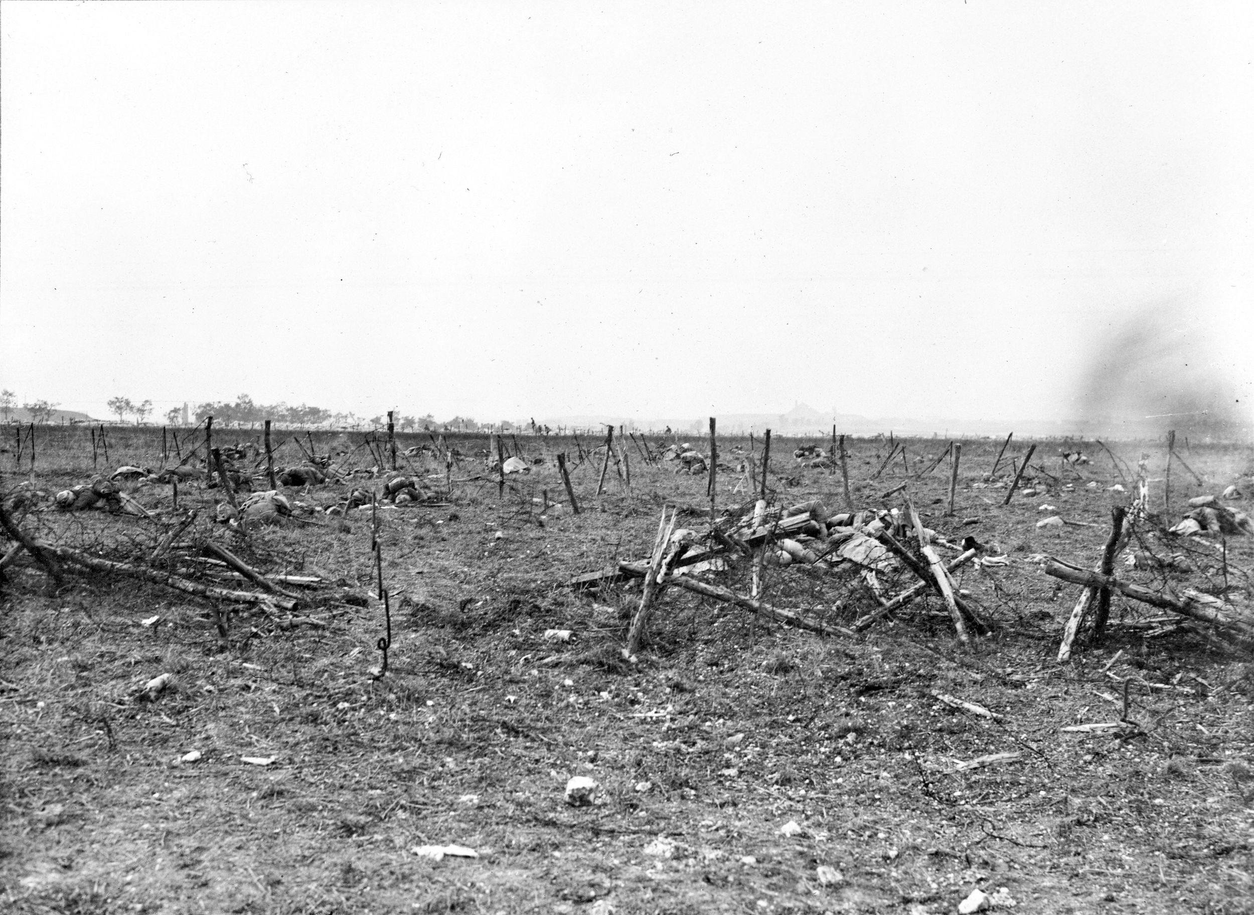 British dead near barbed wire defenses outside a captured German machine-gun emplacement, near Loos, September 28, 1915. Britain lost about 20,000 soldiers during three days of fighting.