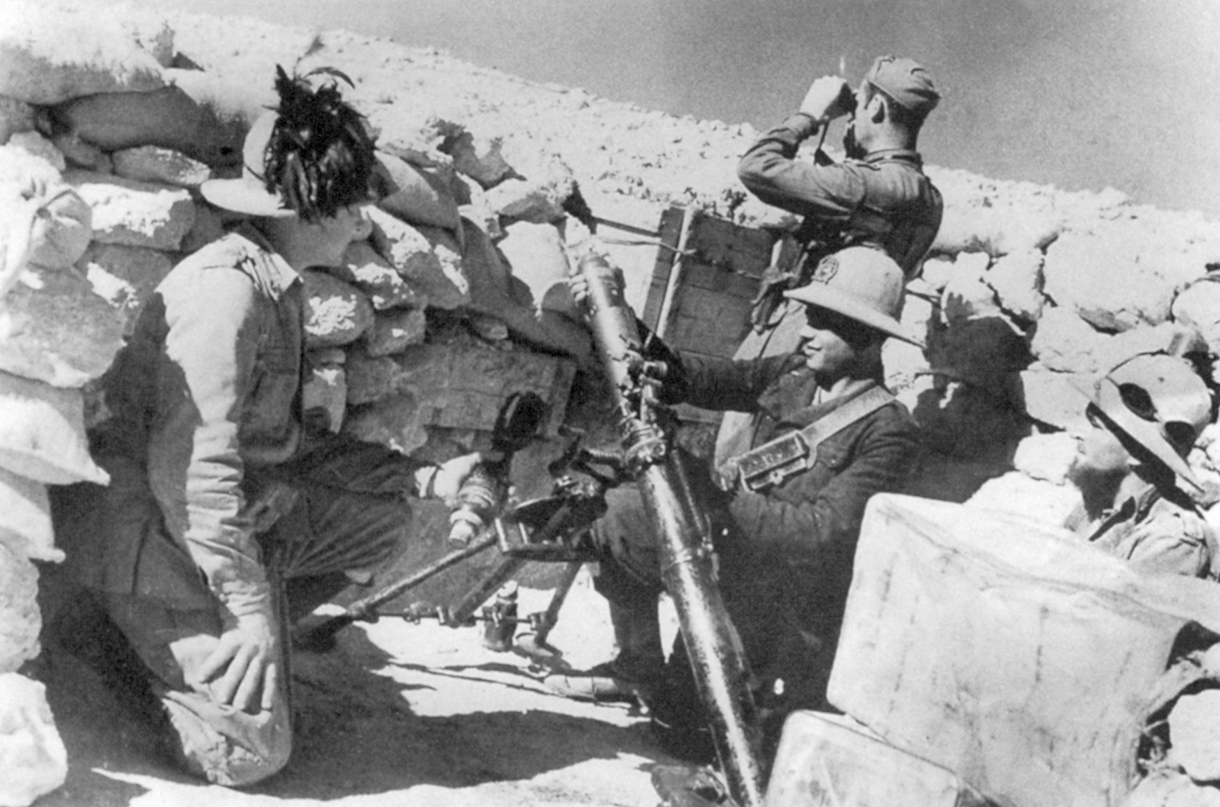 Italian forces in North Africa used a hodgepodge of weaponry, including guns that were handed over to Italy in payment of reparations after WWI. Here, members of a Bersaglieri regiment are firing a British-made mortar.