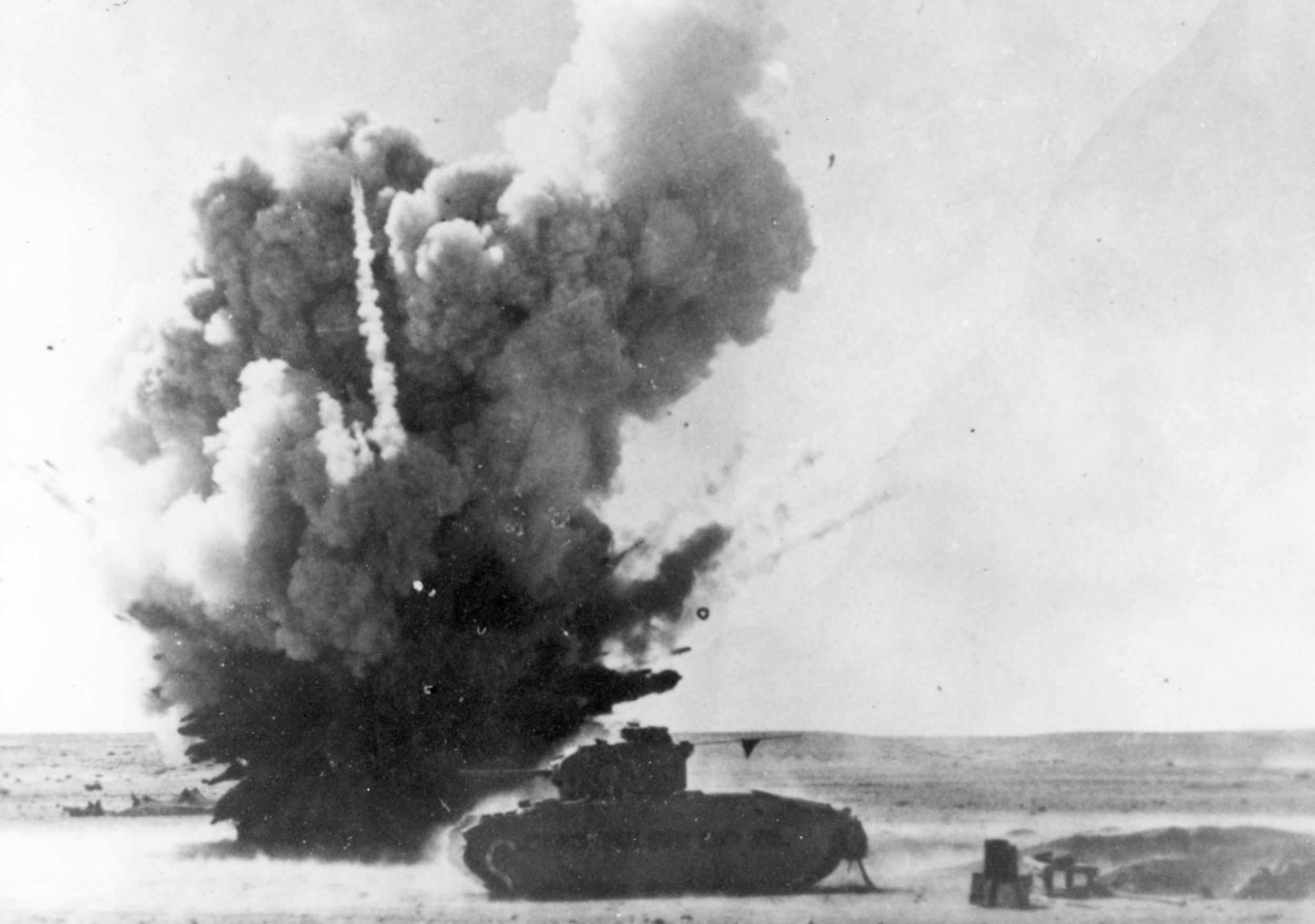 A near miss from an Axis bomb showers a British Matilda tank with shrapnel and debris at Sidi Barrani. The British victory at Sidi Barrani in December 1940 marked the beginning of the three-year struggle for supremacy in North Africa.