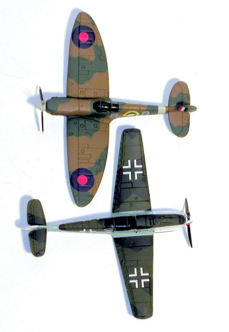 Two Corgi 1/144 scale aircraft from the author’s collection: a German Messer- schmitt at the bottom and a British Spitfire at the top. 