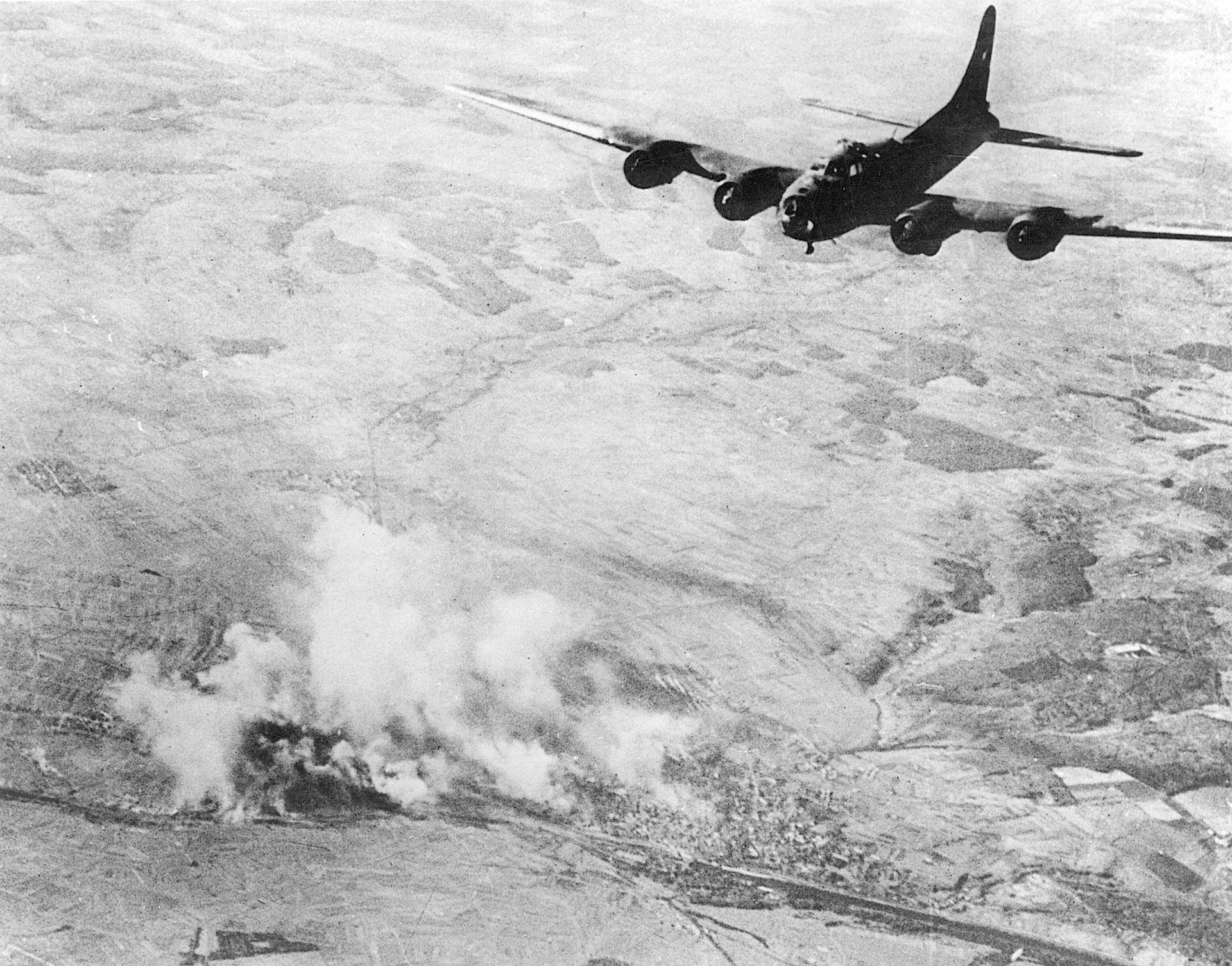 A B-17 flies high above the German city of Schweinfurt, target of costly U.S. daylight raids against ball bearing plants in the area.