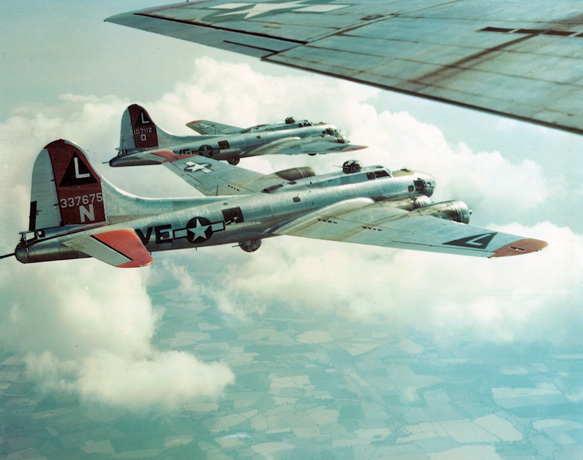 Counting on safety in numbers, B-17 crews practice flying in a box formation over England.