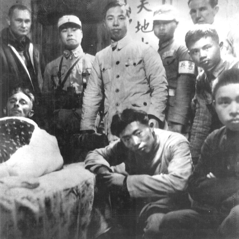Colonel John Hilger (left rear) and two other Doolittle raiders are seen in company with their Chinese rescuers at Chuchow.