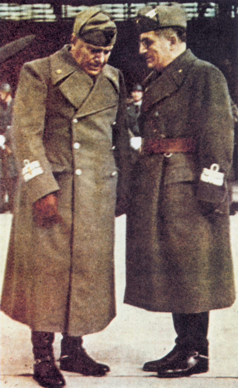 Mussolini confers with General Ugo Cavallero, his new high command chief of staff. Cavallero was called on to help Italian troops avoid disaster in Greece.
