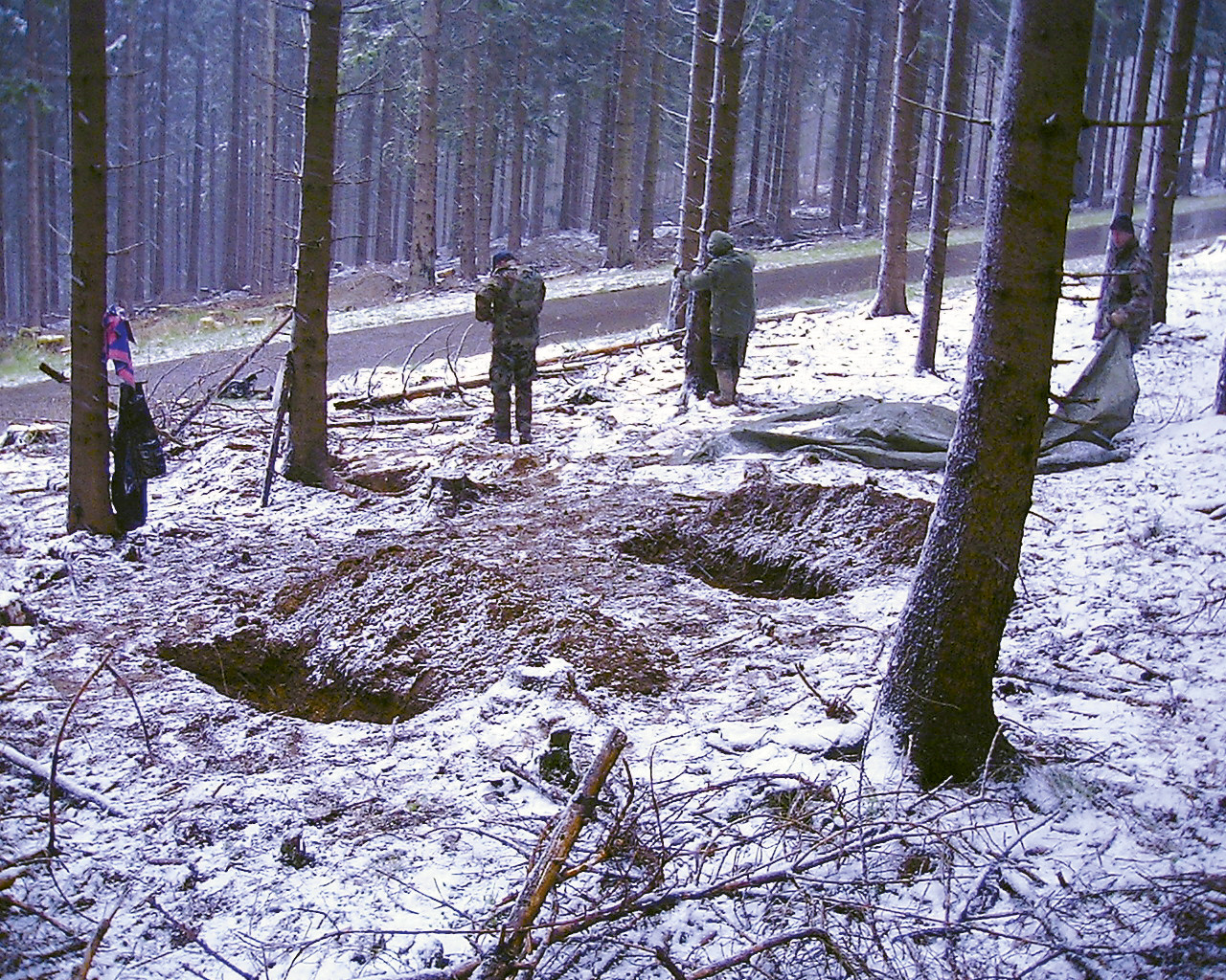The rediscovered graves of Kokotovich (front left), Beckwith (front right), and Read (rear left) are shown on 88 Hill, April 19, 2001.