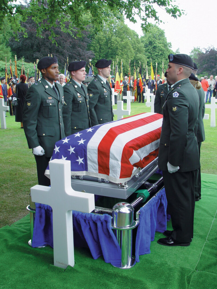 Sgt. Frederick Zimmerman of the 99th is laid to rest in the cemetery at Henri-Chapelle, Belgium, on June 22, 2002.