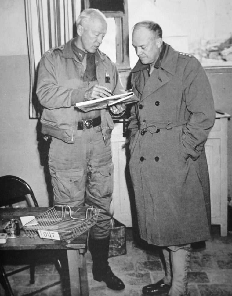 American generals George S. Patton, Jr. (left) and Dwight D. Eisenhower discuss troop dispositions in Tunisia in early 1943.