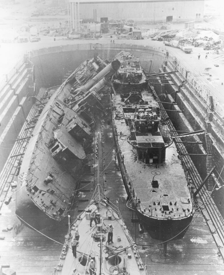 In January 1942, the destroyers Cassin and Downes lie stripped of equipment in Dry Dock Number One.