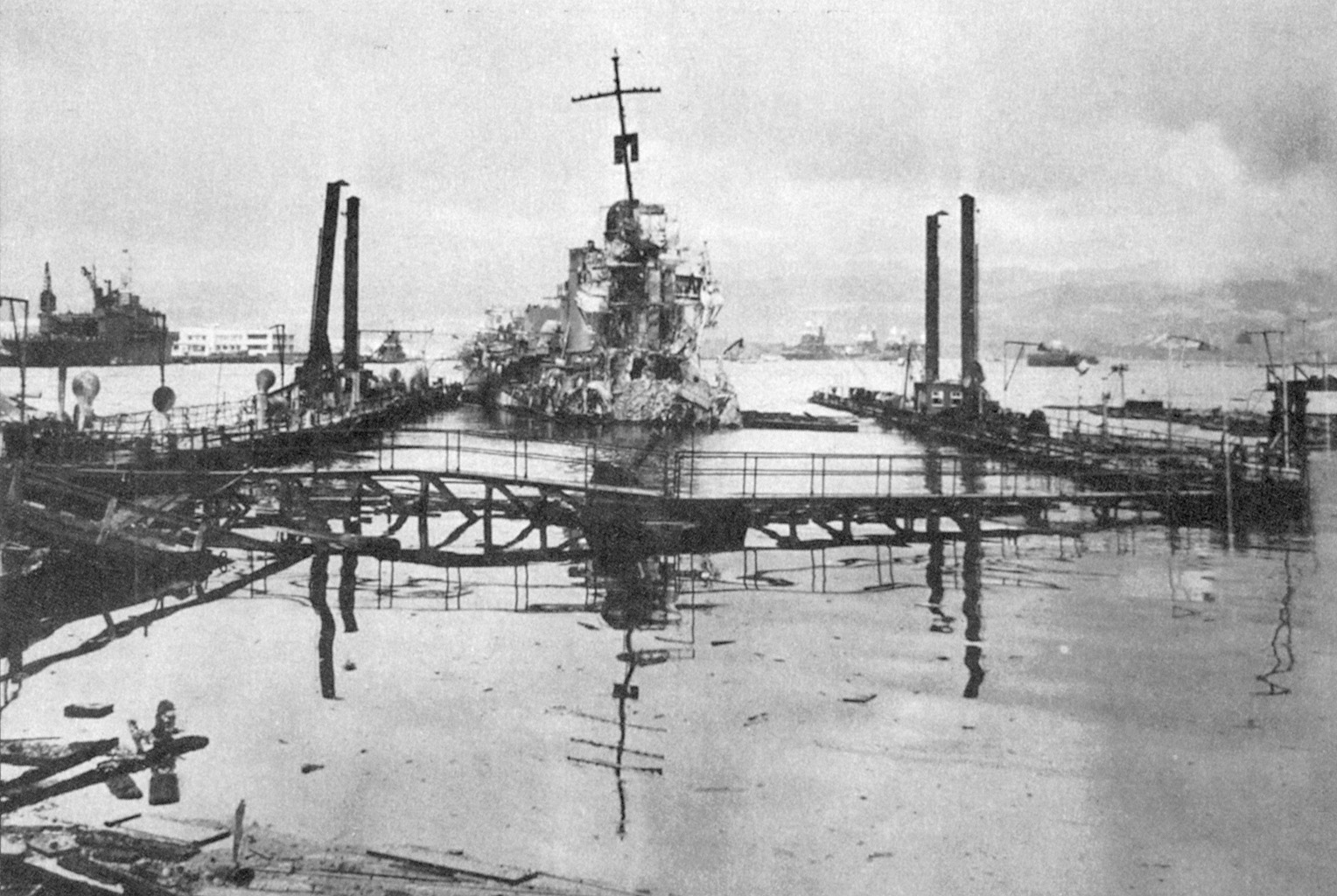 The heavily damaged destroyer Shaw floats in dry dock on December 8, 1941.