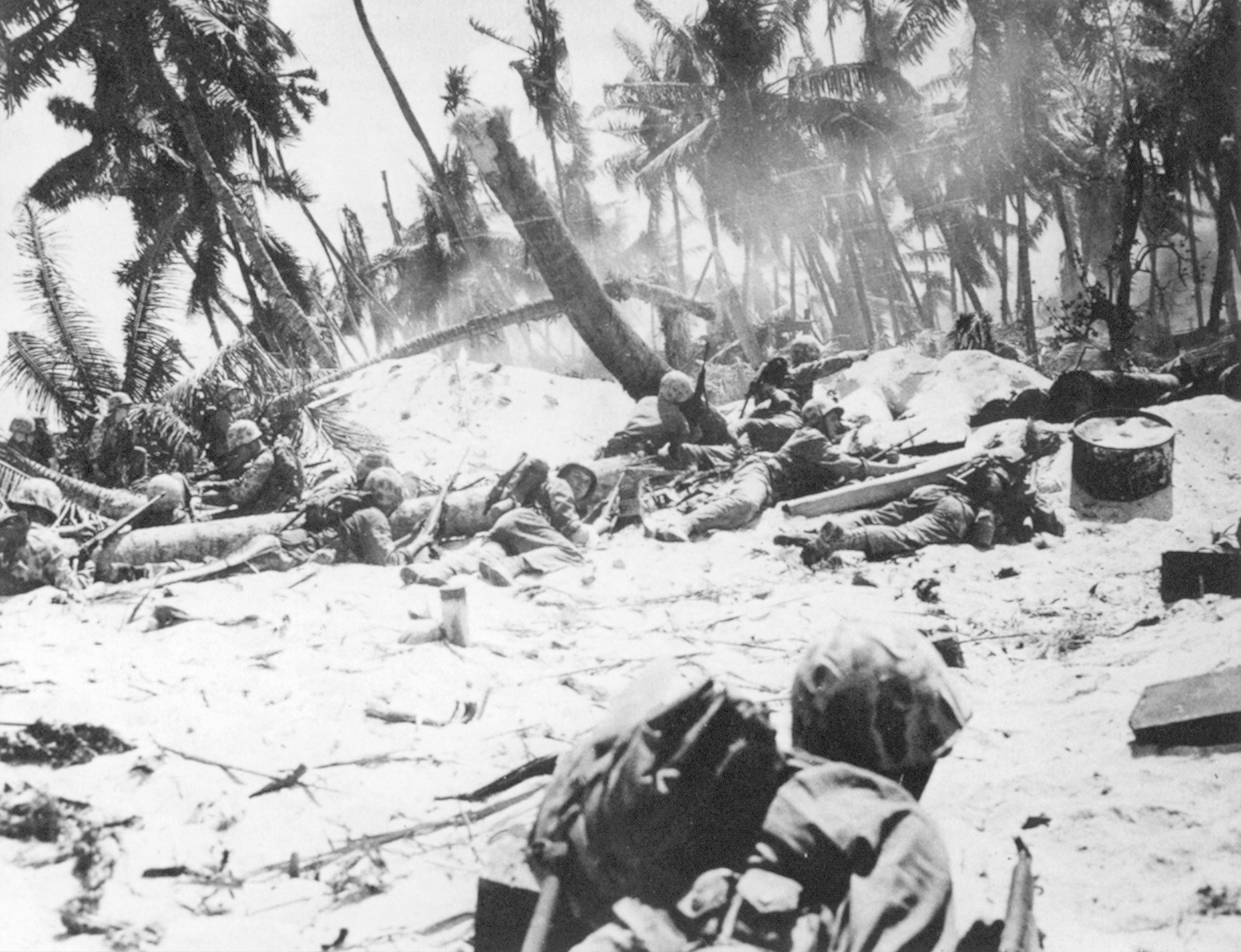Pinned down by Japanese fire, a group of Marines assesses its situation. Individual acts of heroism often led the way, but few significant advances were made on the day of the initial assault.