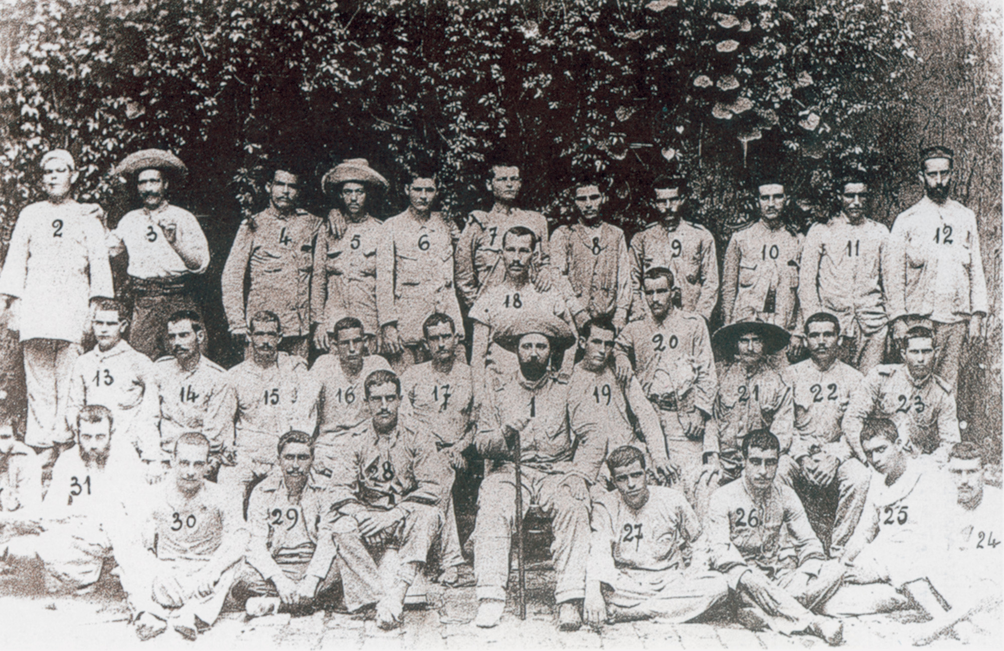 An assembly of Spanish survivors as they were photographed in Manila in July 1899. Martin Cerezo is seated at the center holding a cane. Upon their arrival in Spain later in the summer, these men were received as heroes. 