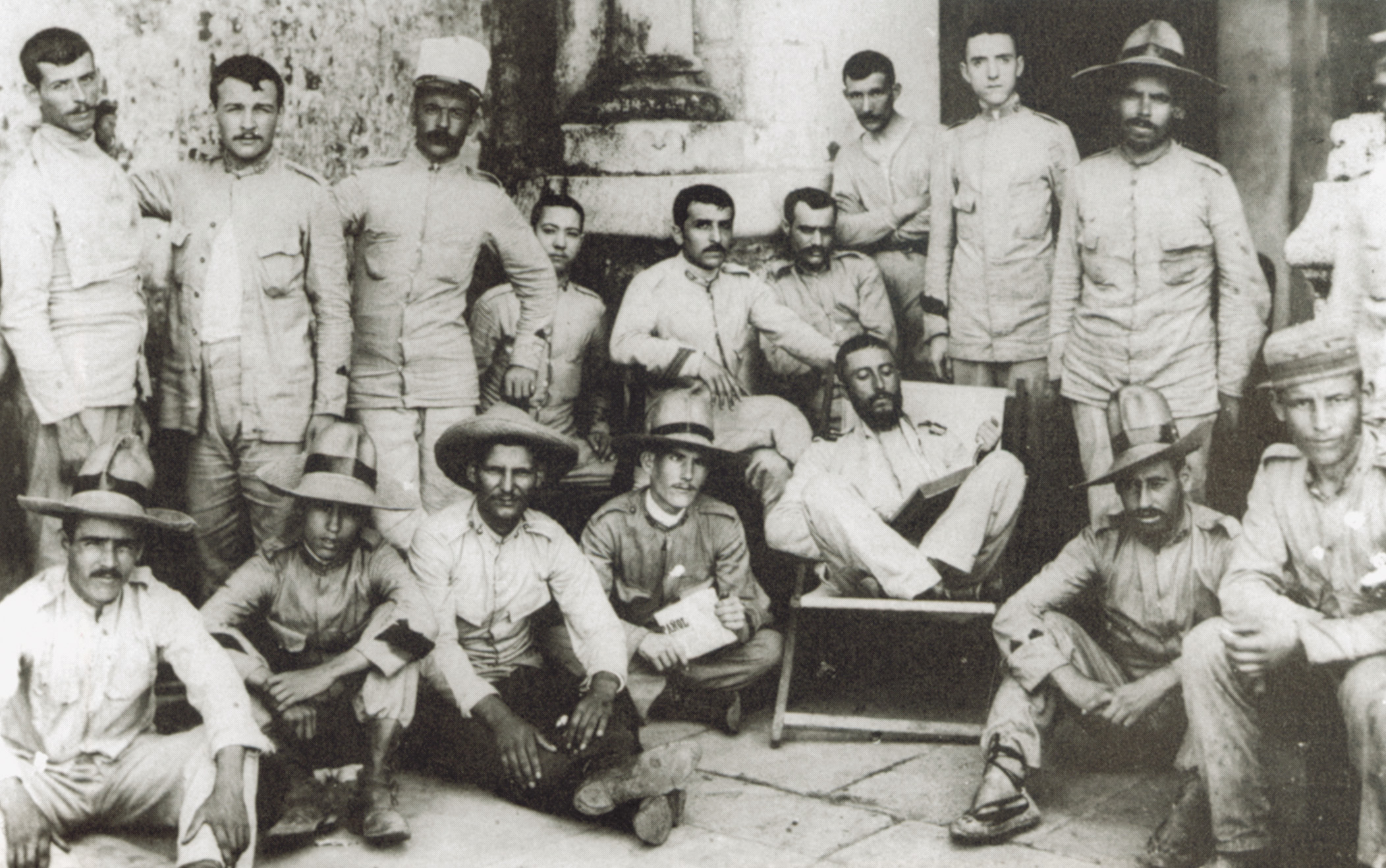 Spanish soldiers relax for a photograph. Men such as these were scattered about the Philippines, some to attempt to hold the large city of Manila, others to hold lesser points and villages. 